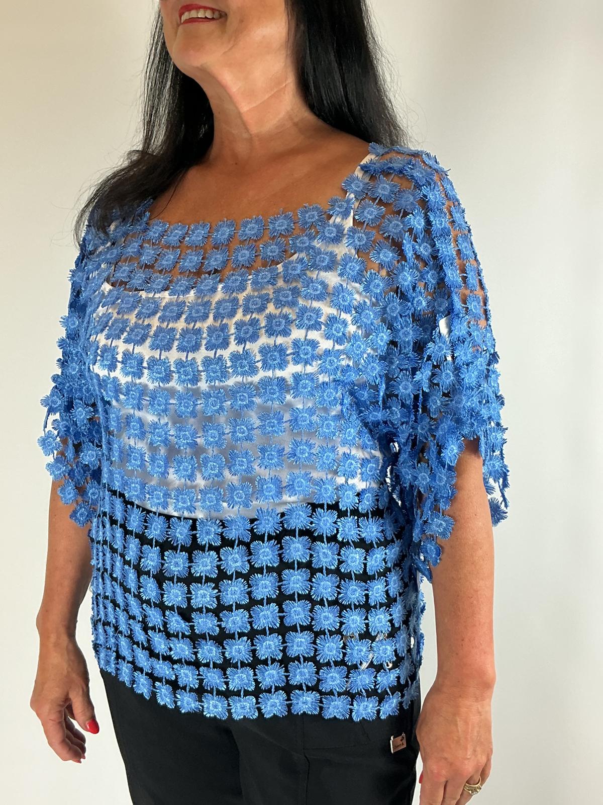 Ladies Blue semi-sheer floral embroidered top with short sleeves, a relaxed fit and scalloped edges