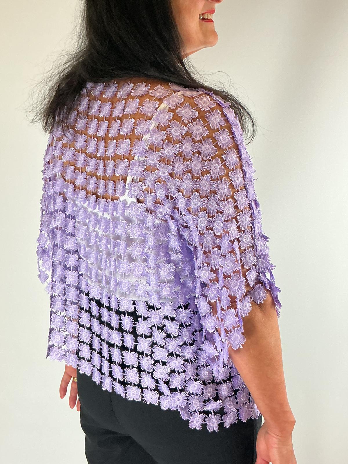 Ladies Lilac semi-sheer floral embroidered top with short sleeves, a relaxed fit and scalloped edges