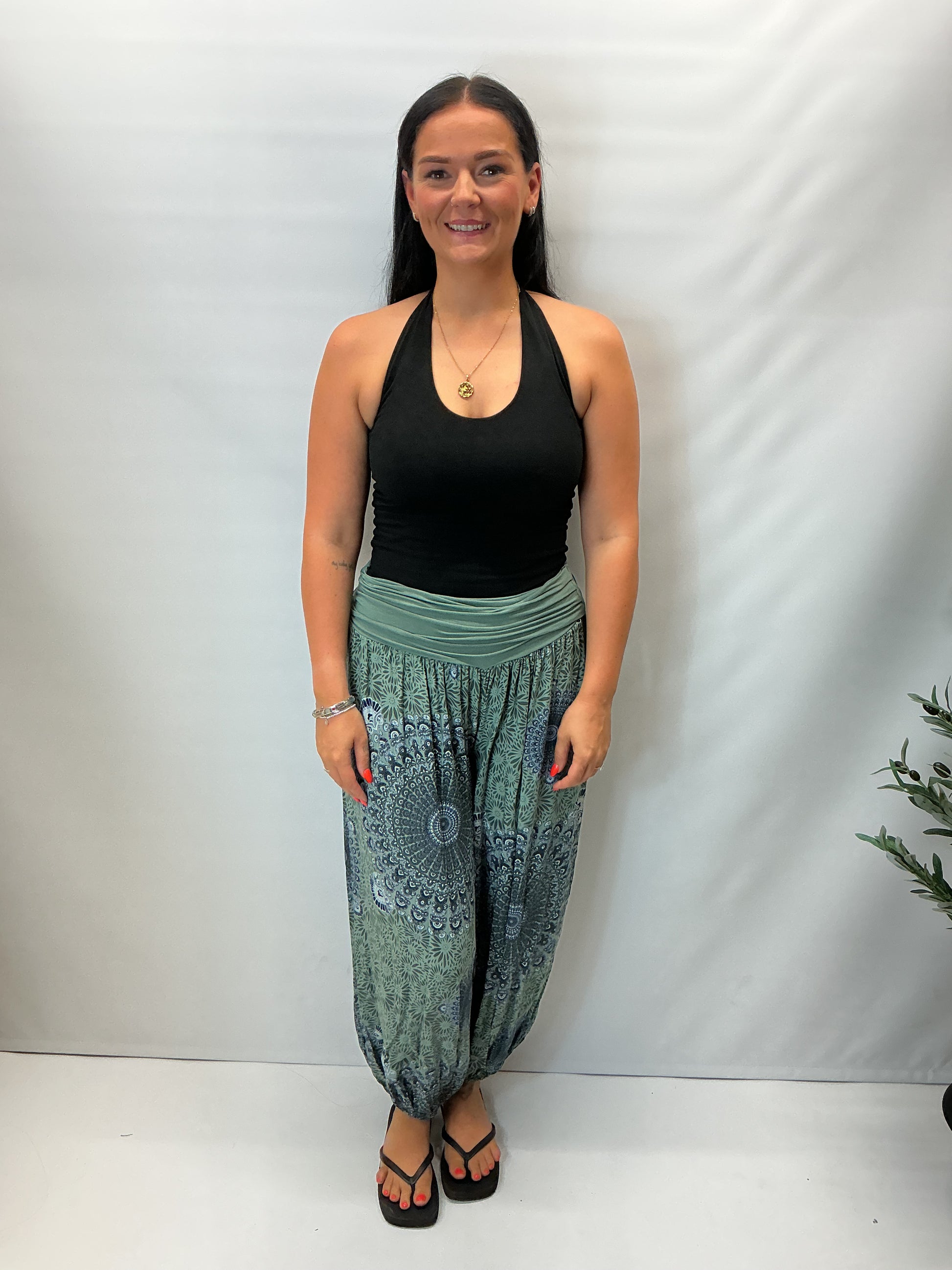 Women's Italian khaki green mandala print harem trousers with stretch waistband, relaxed balloon leg fit and elasticated cuffs.