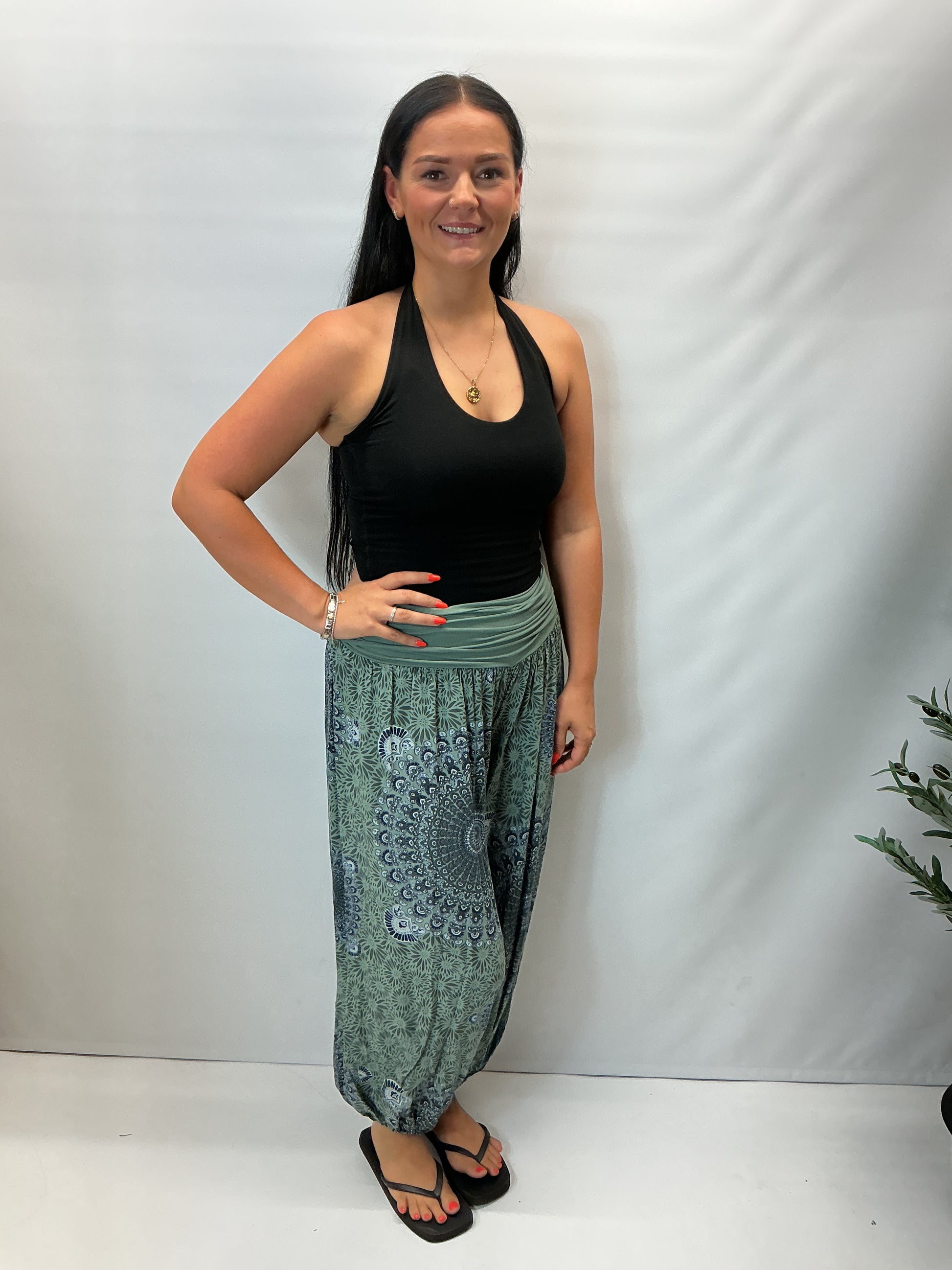 Women's Italian khaki green mandala print harem trousers with stretch waistband, relaxed balloon leg fit and elasticated cuffs.