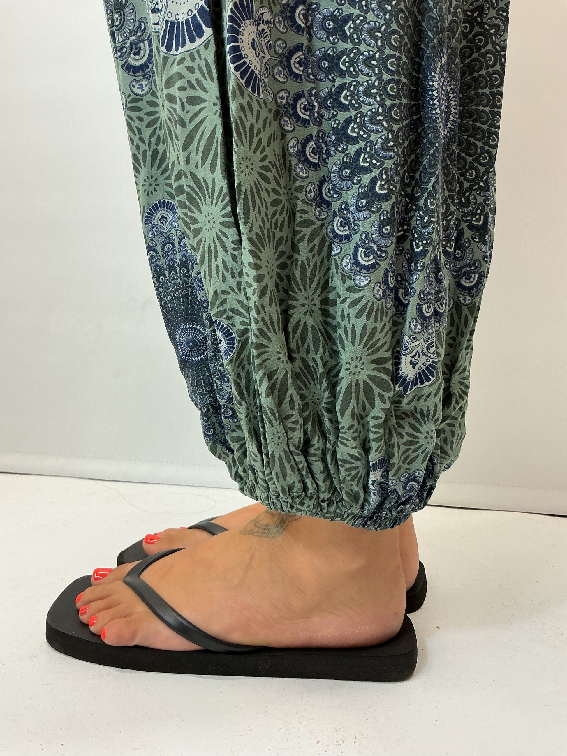 Women's Italian khaki green mandala print harem trousers with stretch waistband, relaxed balloon leg fit and elasticated cuffs.