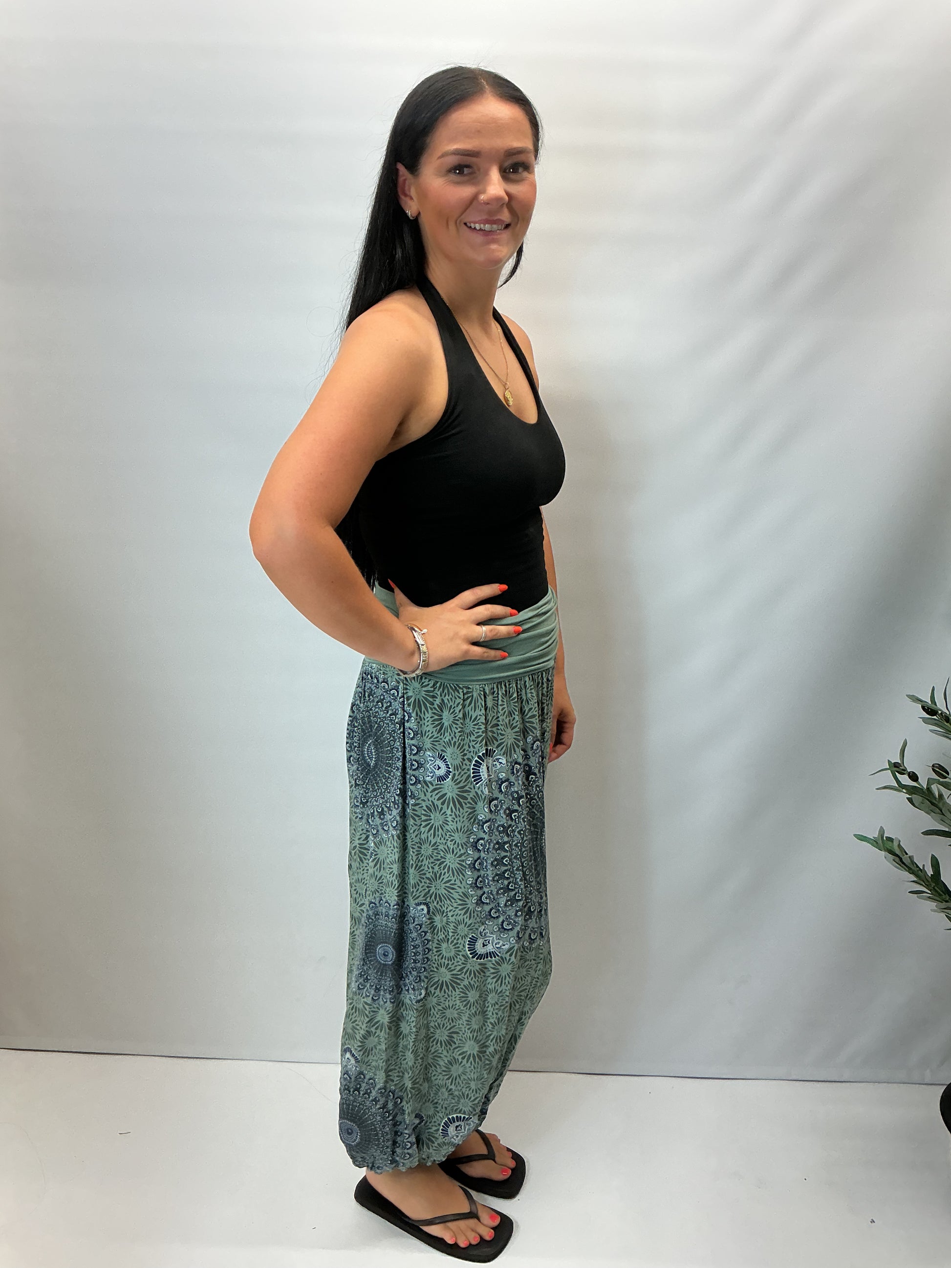 Women's Italian khaki green mandala print harem trousers with stretch waistband, relaxed balloon leg fit and elasticated cuffs.