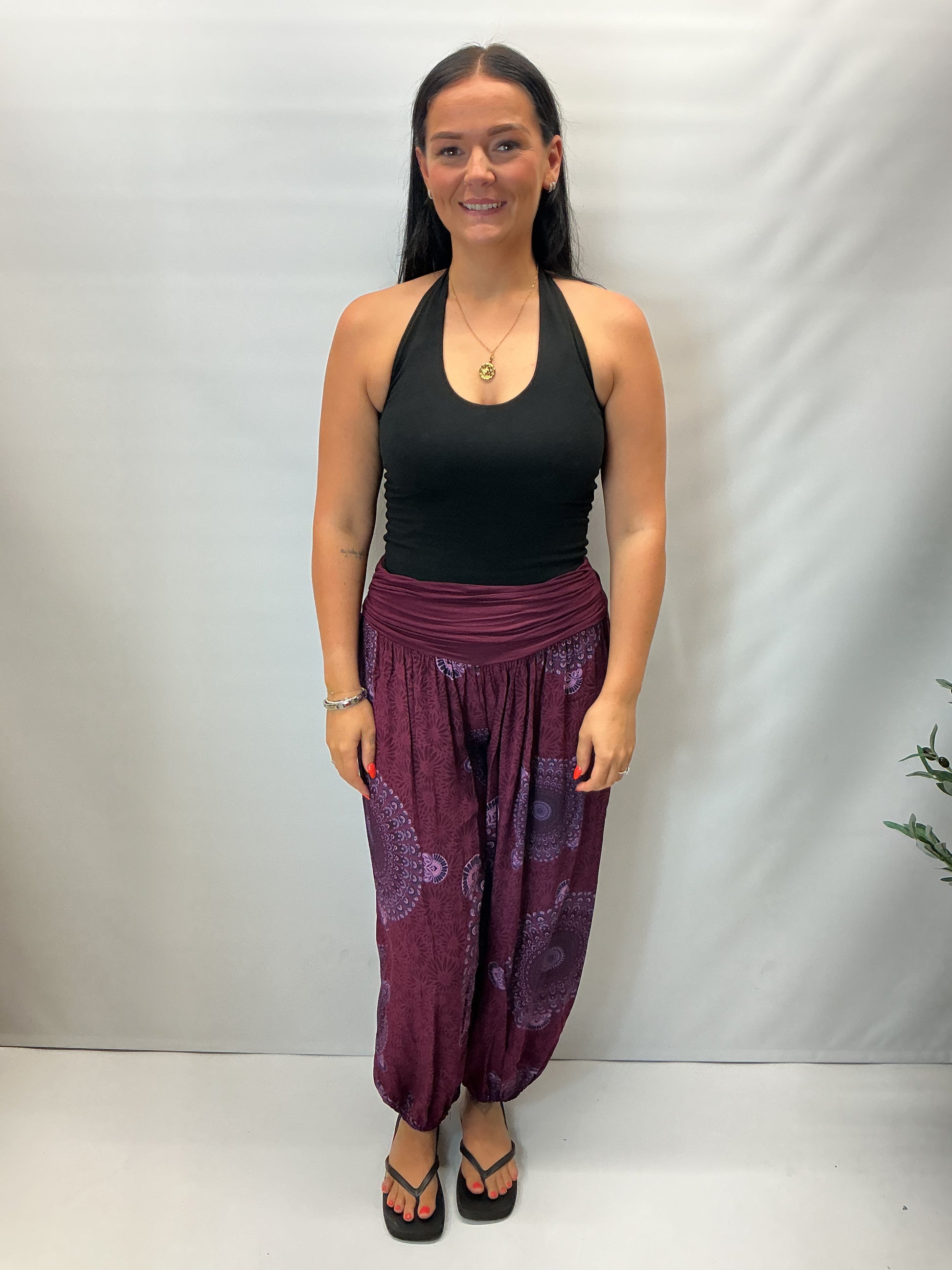 Women's Italian maroon mandala print harem trousers with stretch waistband, relaxed balloon leg fit and elasticated cuffs.