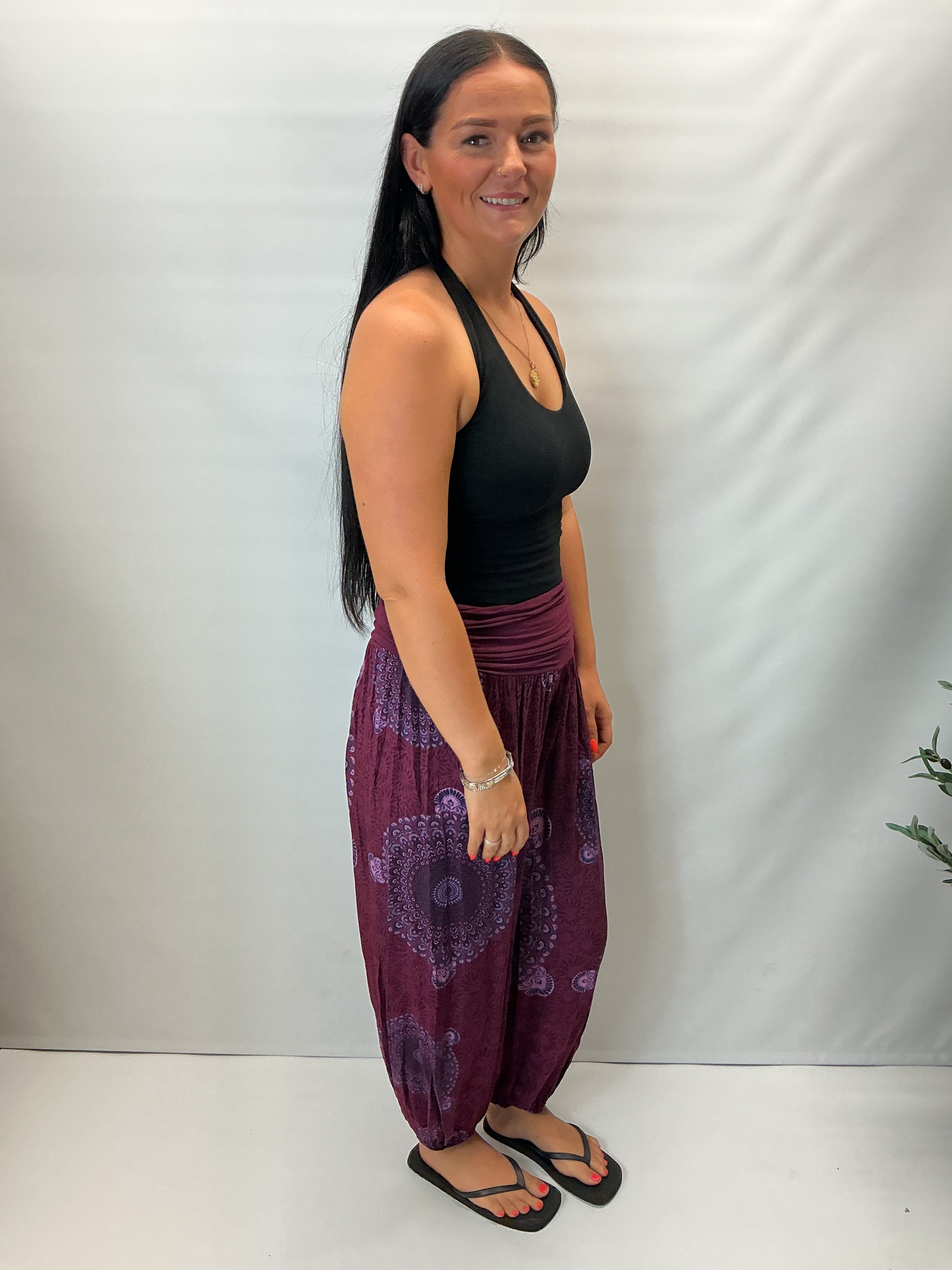 Women's Italian maroon mandala print harem trousers with stretch waistband, relaxed balloon leg fit and elasticated cuffs.