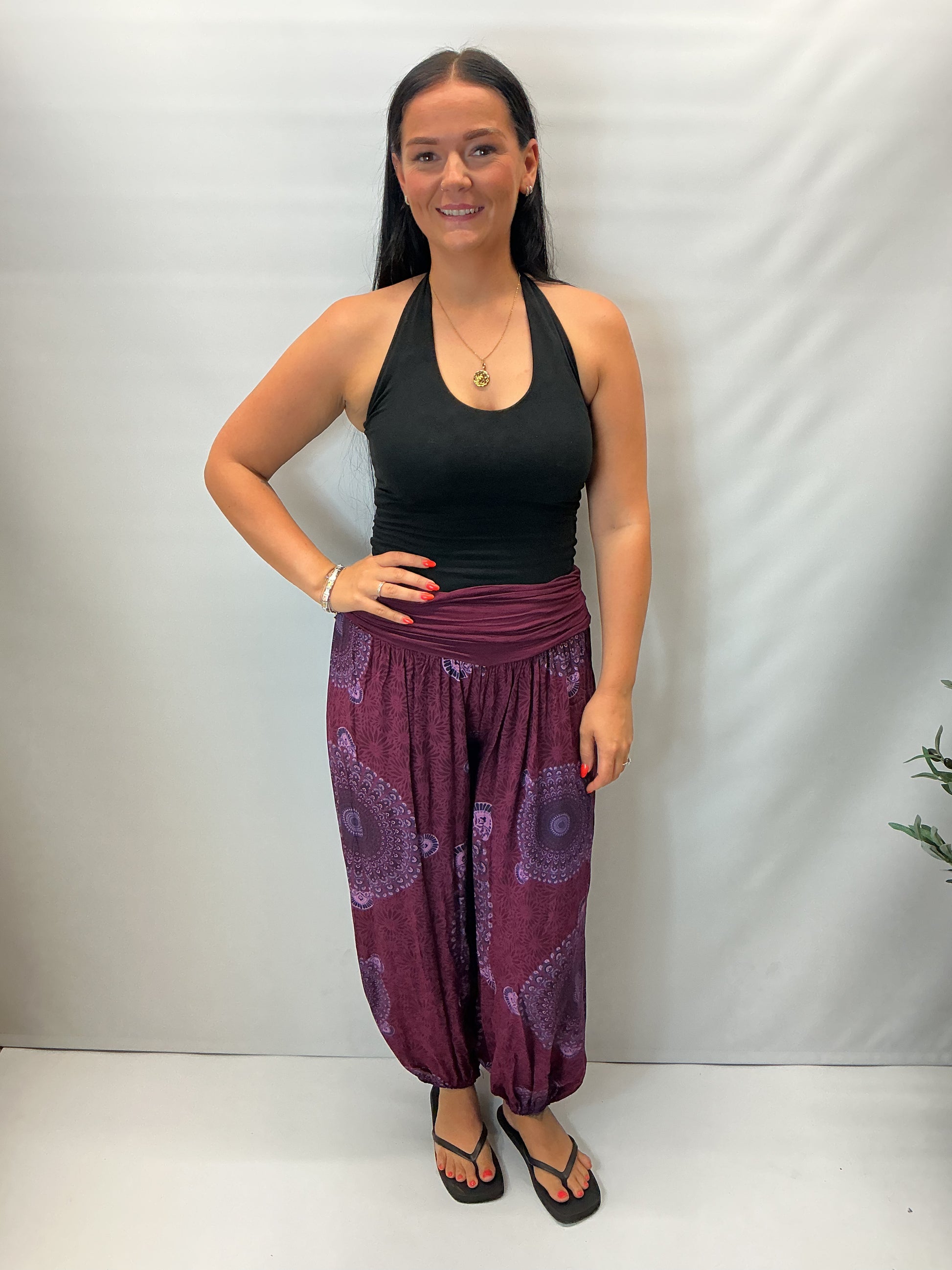 Women's Italian maroon mandala print harem trousers with stretch waistband, relaxed balloon leg fit and elasticated cuffs.