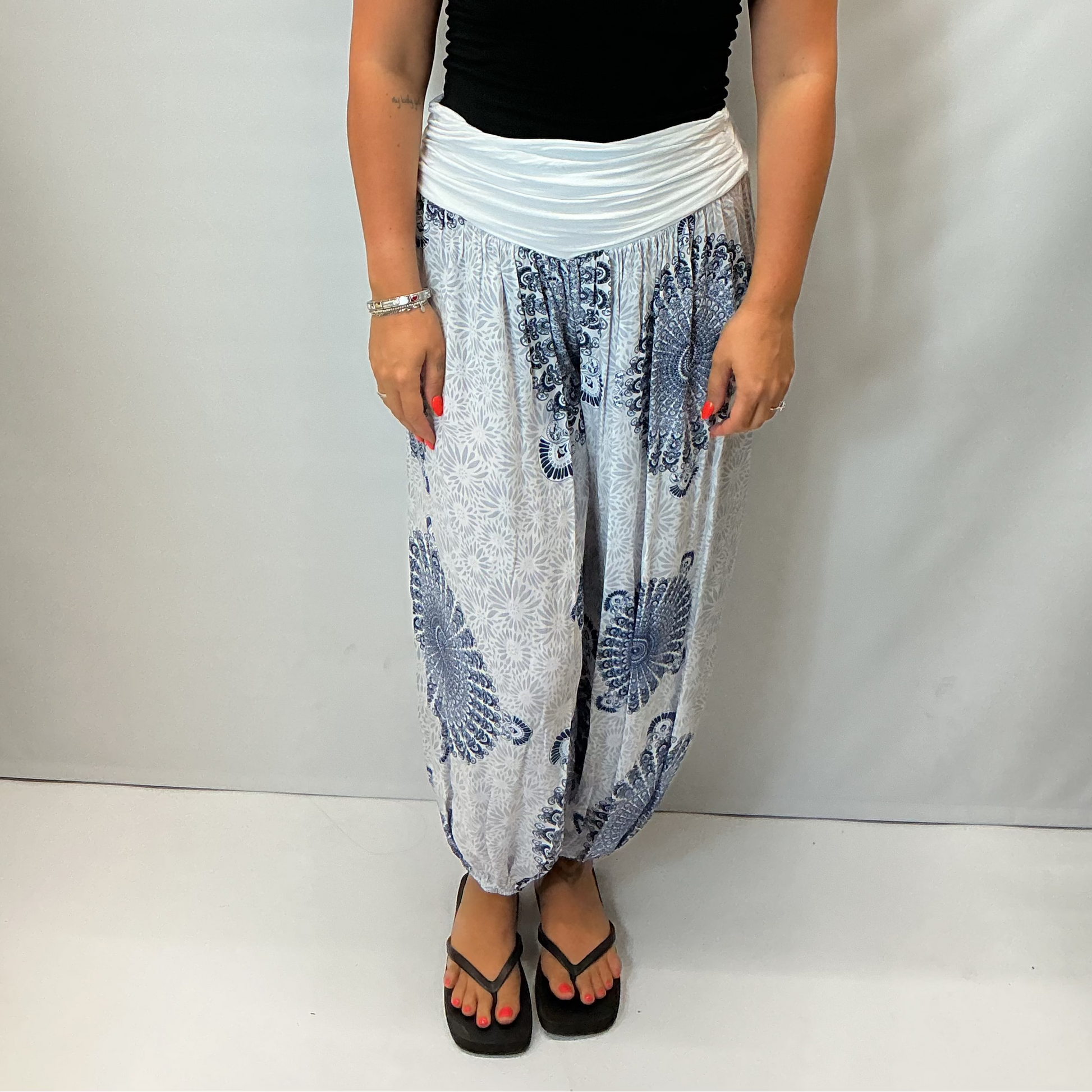 Women's Italian white mandala print harem trousers with stretch waistband, relaxed balloon leg fit and elasticated cuffs.