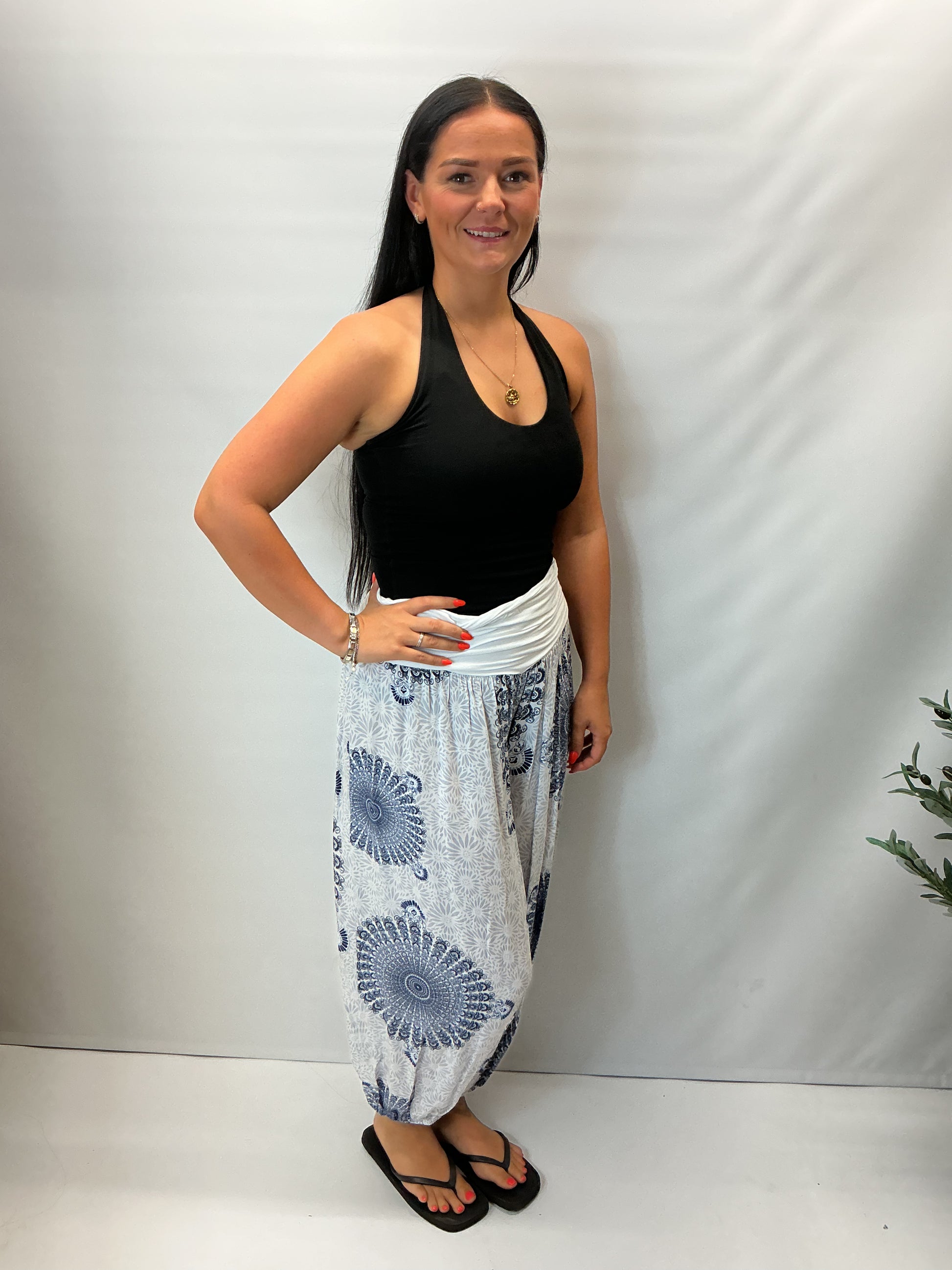 Women's Italian white mandala print harem trousers with stretch waistband, relaxed balloon leg fit and elasticated cuffs.