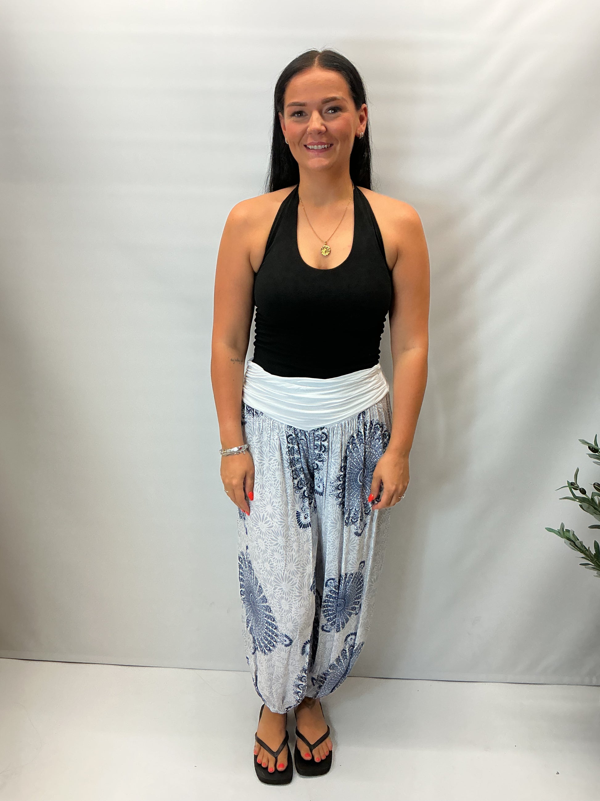 Women's Italian white mandala print harem trousers with stretch waistband, relaxed balloon leg fit and elasticated cuffs.