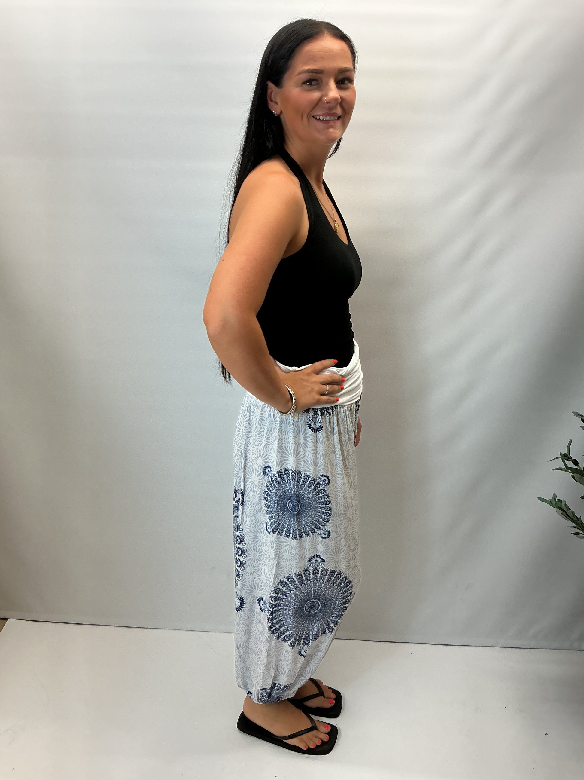 Women's Italian white mandala print harem trousers with stretch waistband, relaxed balloon leg fit and elasticated cuffs.