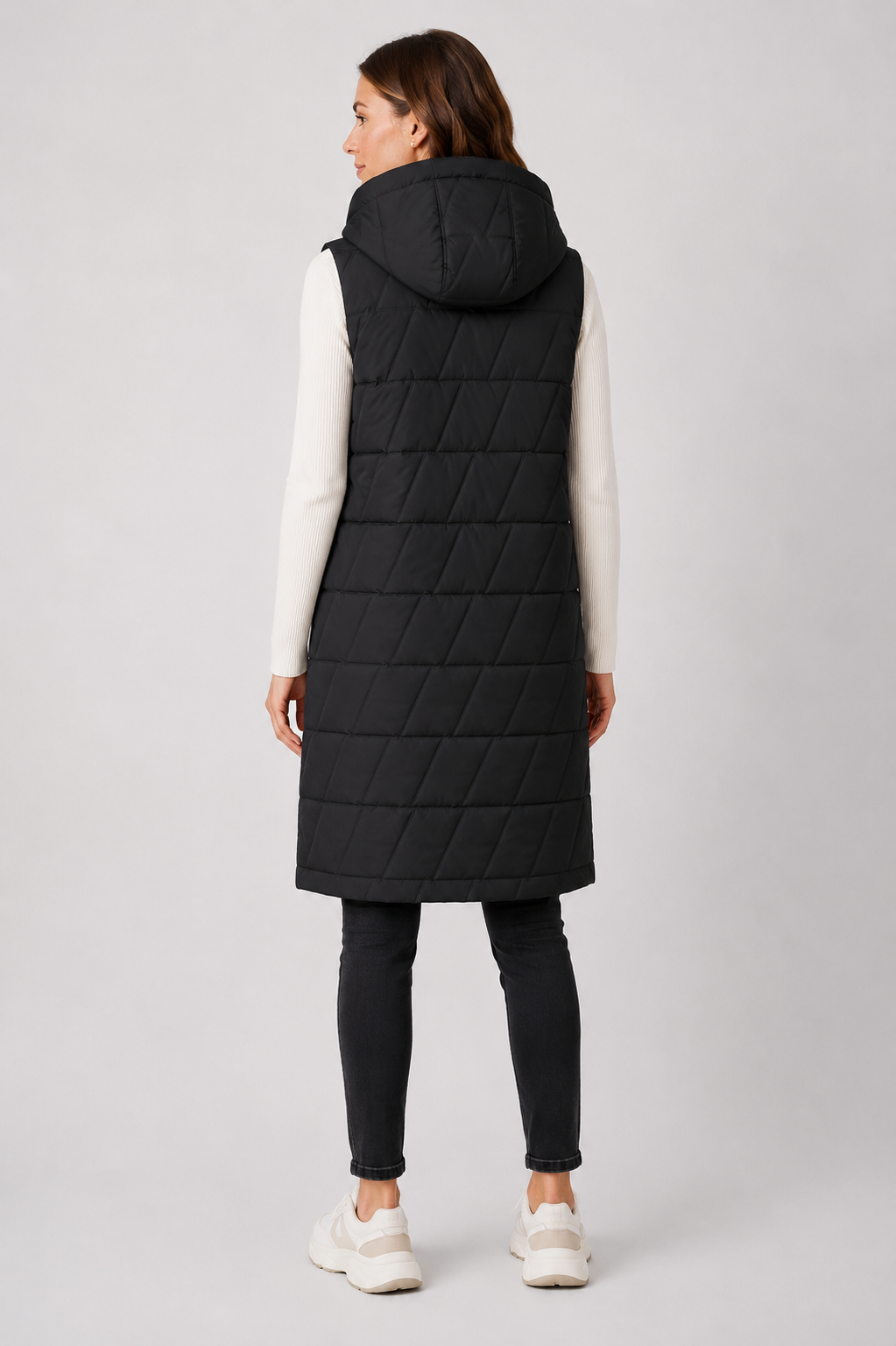 Ladies longline quilted bodywarmer in black with hood and snap-button front