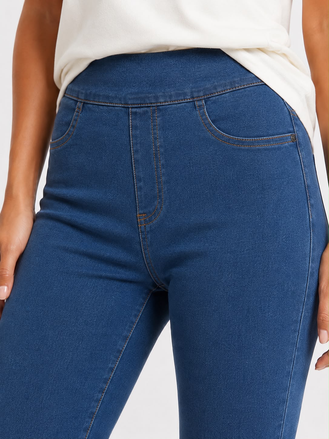 Women’s blue high waisted denim jeggings with a slim fit, stretch fabric and five-pocket design.