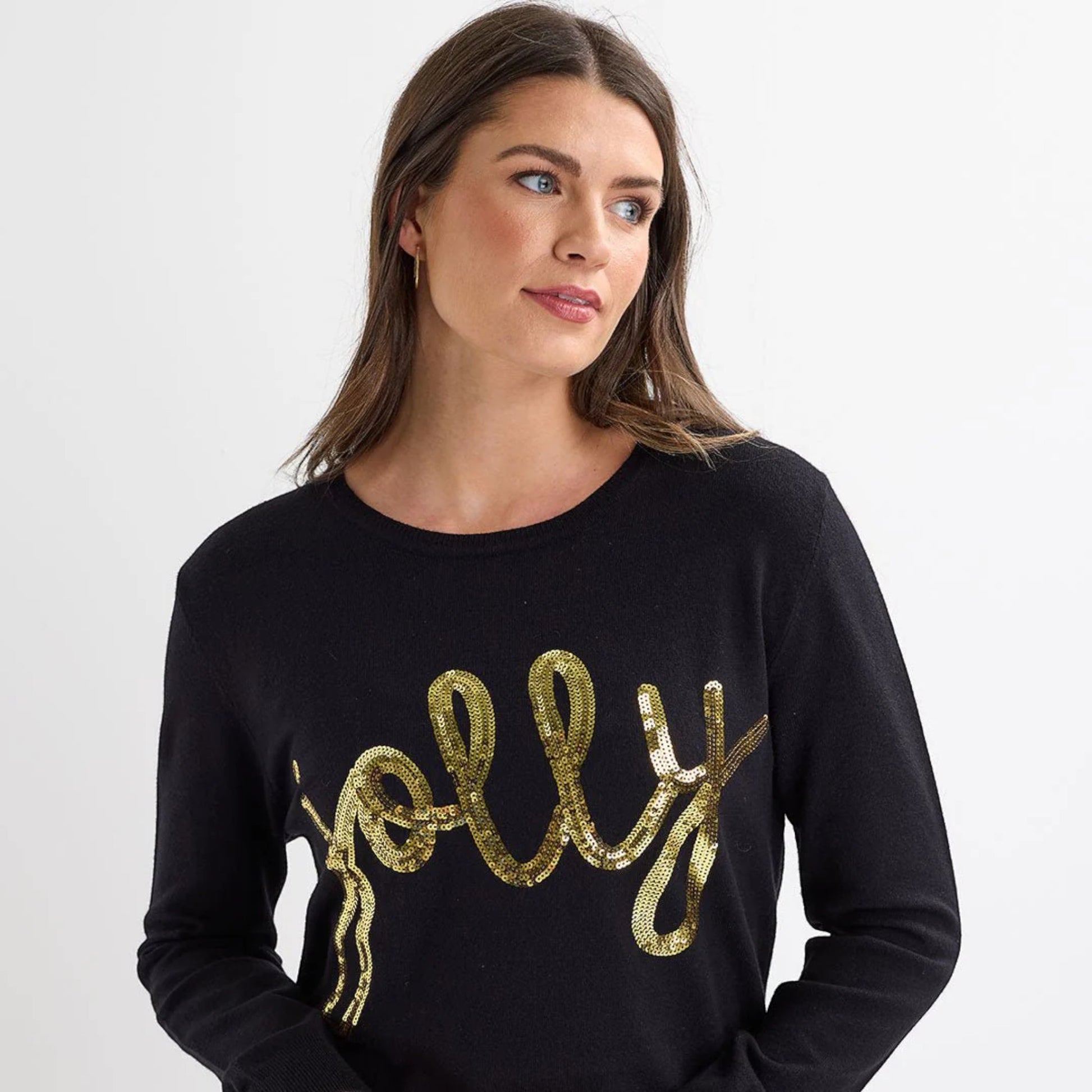 Ladies black Christmas jumper with gold sequin ‘jolly’ slogan, long sleeves and a festive xmas design.