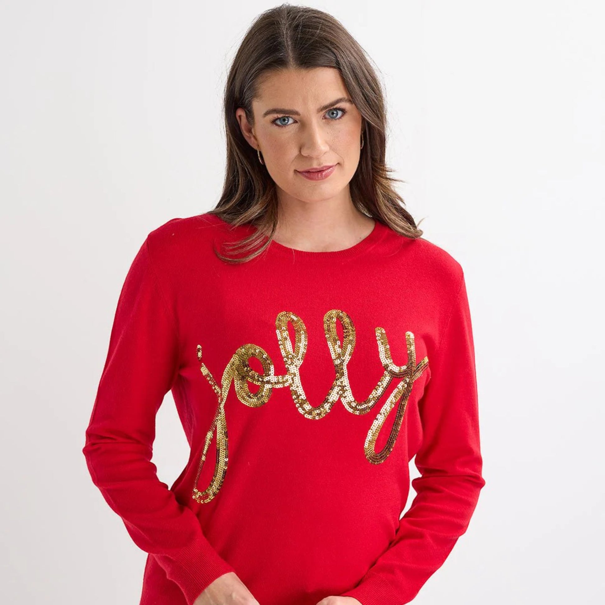 Ladies red Christmas jumper with gold sequin ‘jolly’ slogan, long sleeves and a festive xmas design.