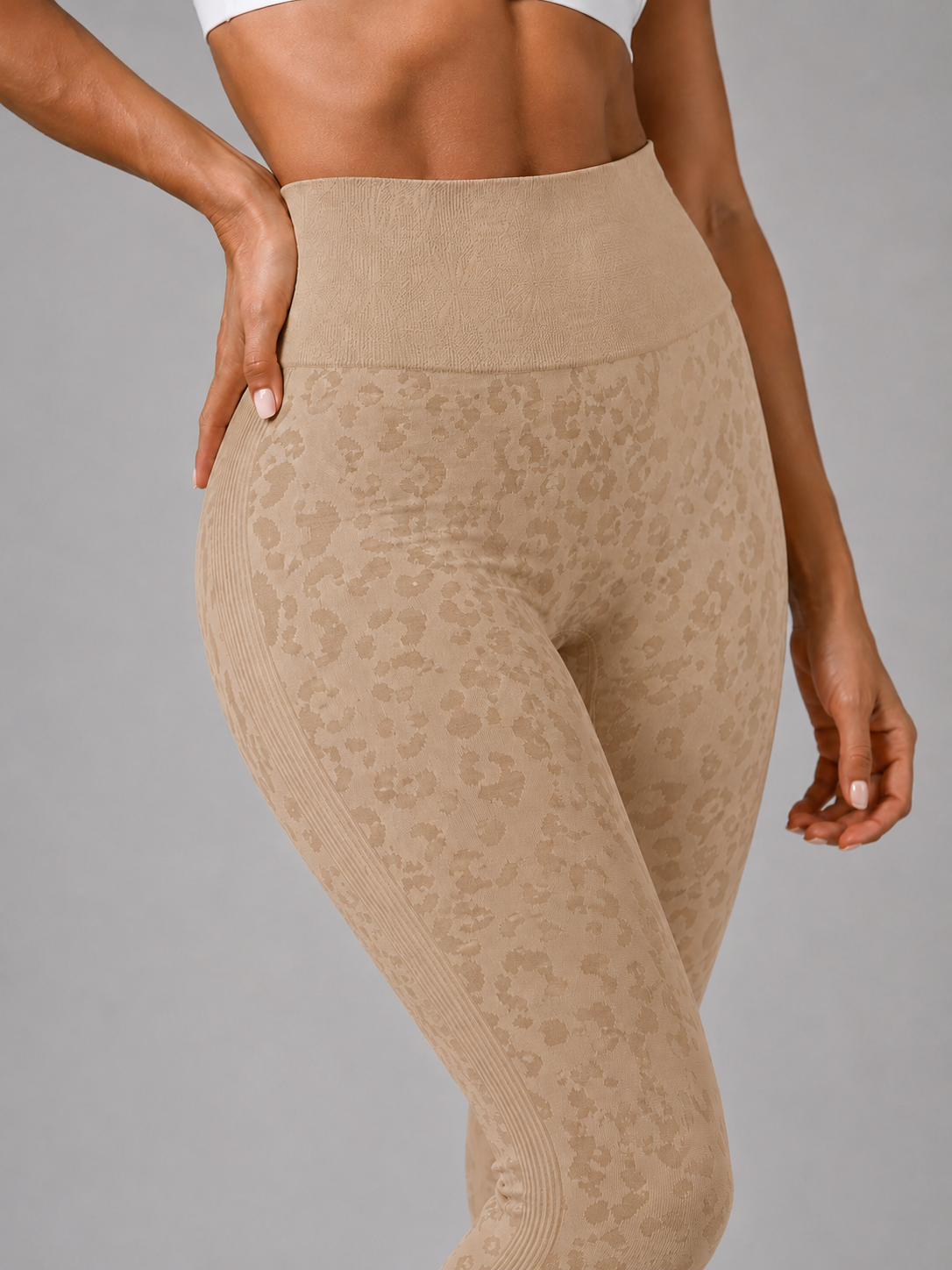 Womens beige leopard print seamless high waisted gym leggings with textured jacquard pattern and ribbed waistband activewear tights