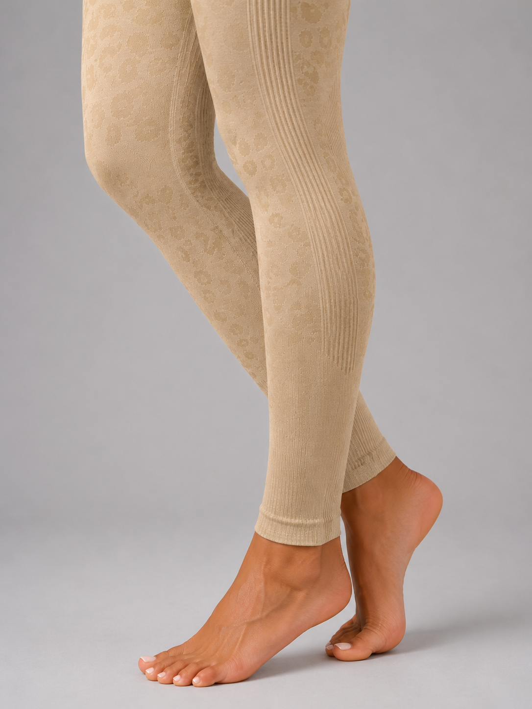 Womens beige leopard print seamless high waisted gym leggings with textured jacquard pattern and ribbed waistband activewear tights
