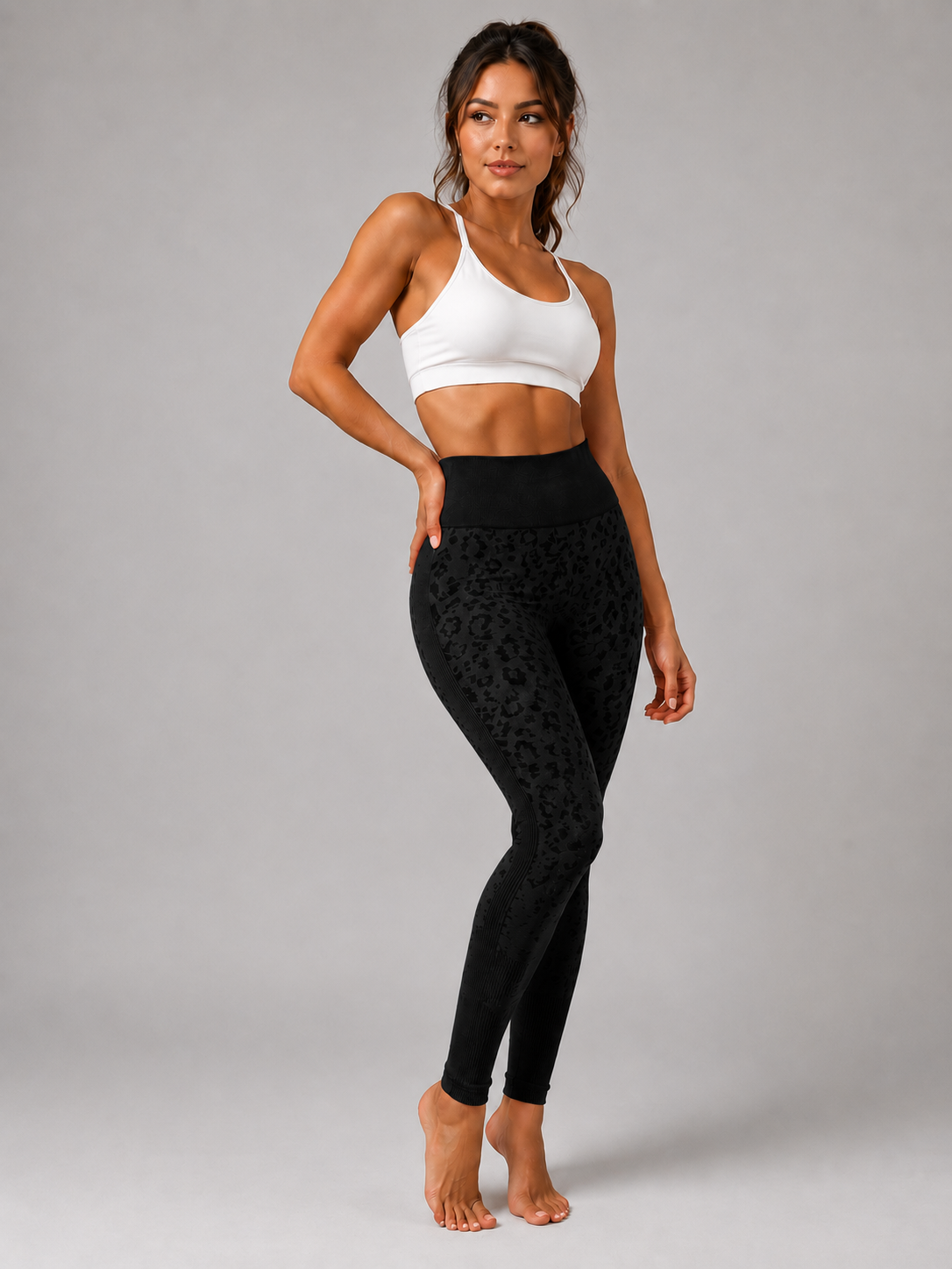 Womens black leopard print seamless high waisted gym leggings with textured jacquard pattern and ribbed waistband activewear tights