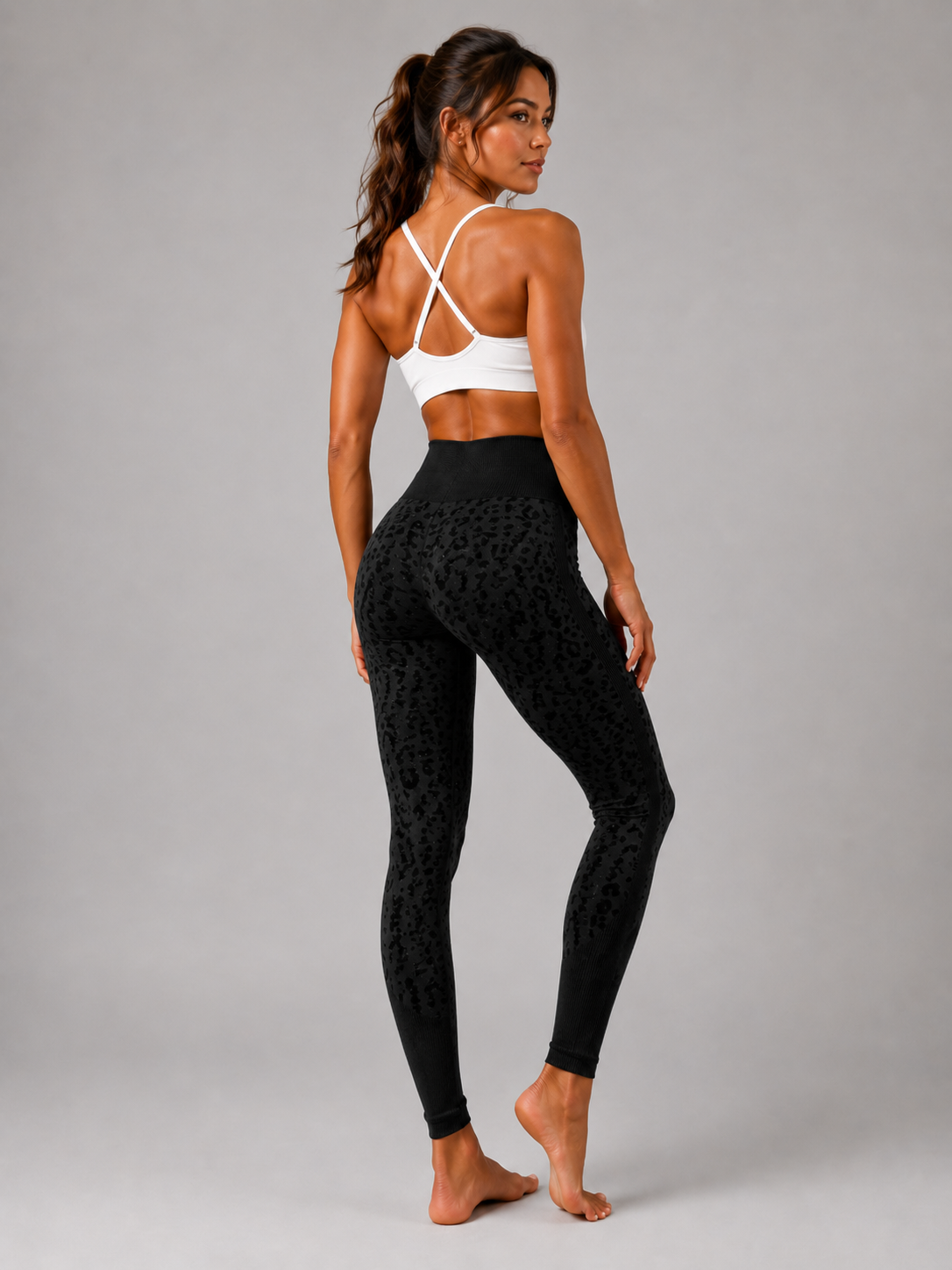 Womens black leopard print seamless high waisted gym leggings with textured jacquard pattern and ribbed waistband activewear tights