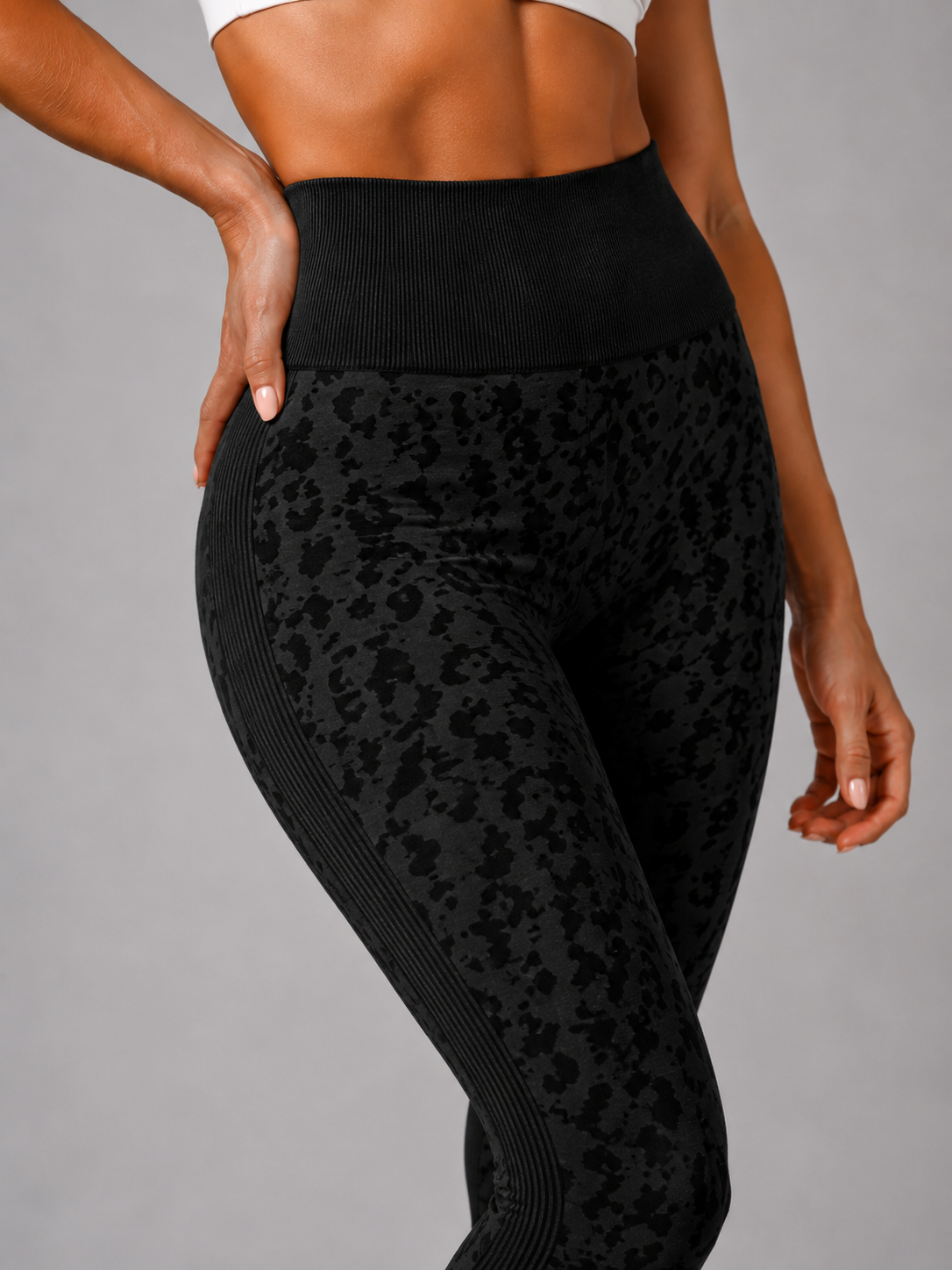 Womens black leopard print seamless high waisted gym leggings with textured jacquard pattern and ribbed waistband activewear tights