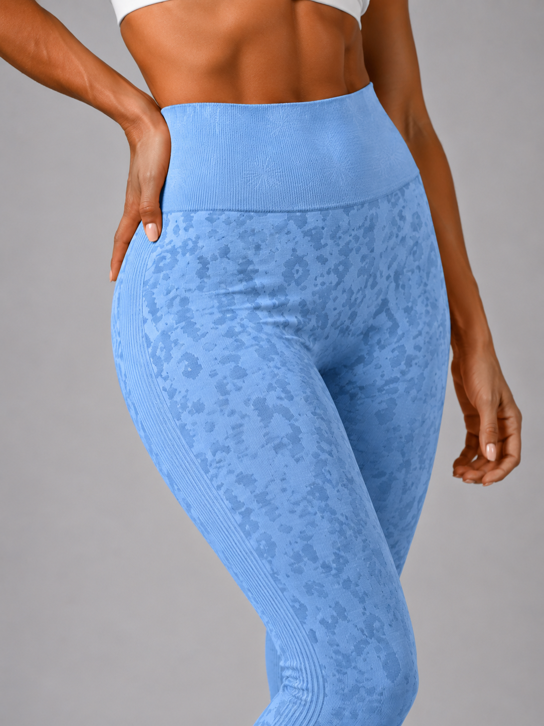 Womens light blue leopard print seamless high waisted gym leggings with textured jacquard pattern and ribbed waistband activewear tights