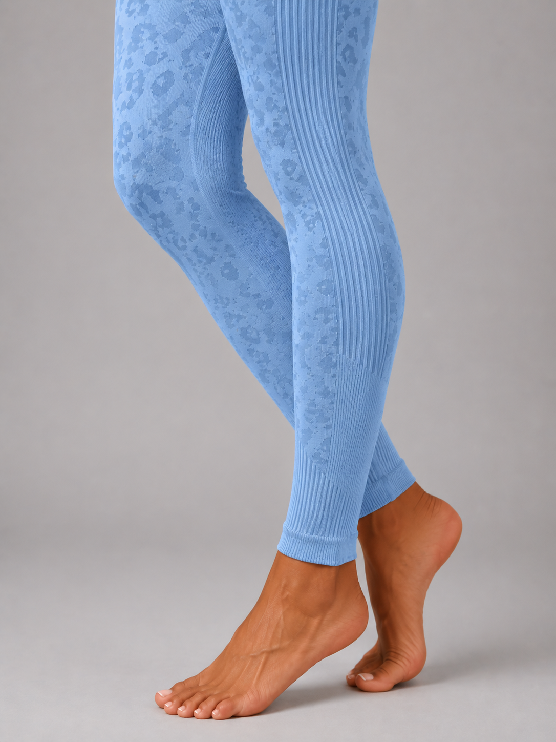 Womens light blue leopard print seamless high waisted gym leggings with textured jacquard pattern and ribbed waistband activewear tights