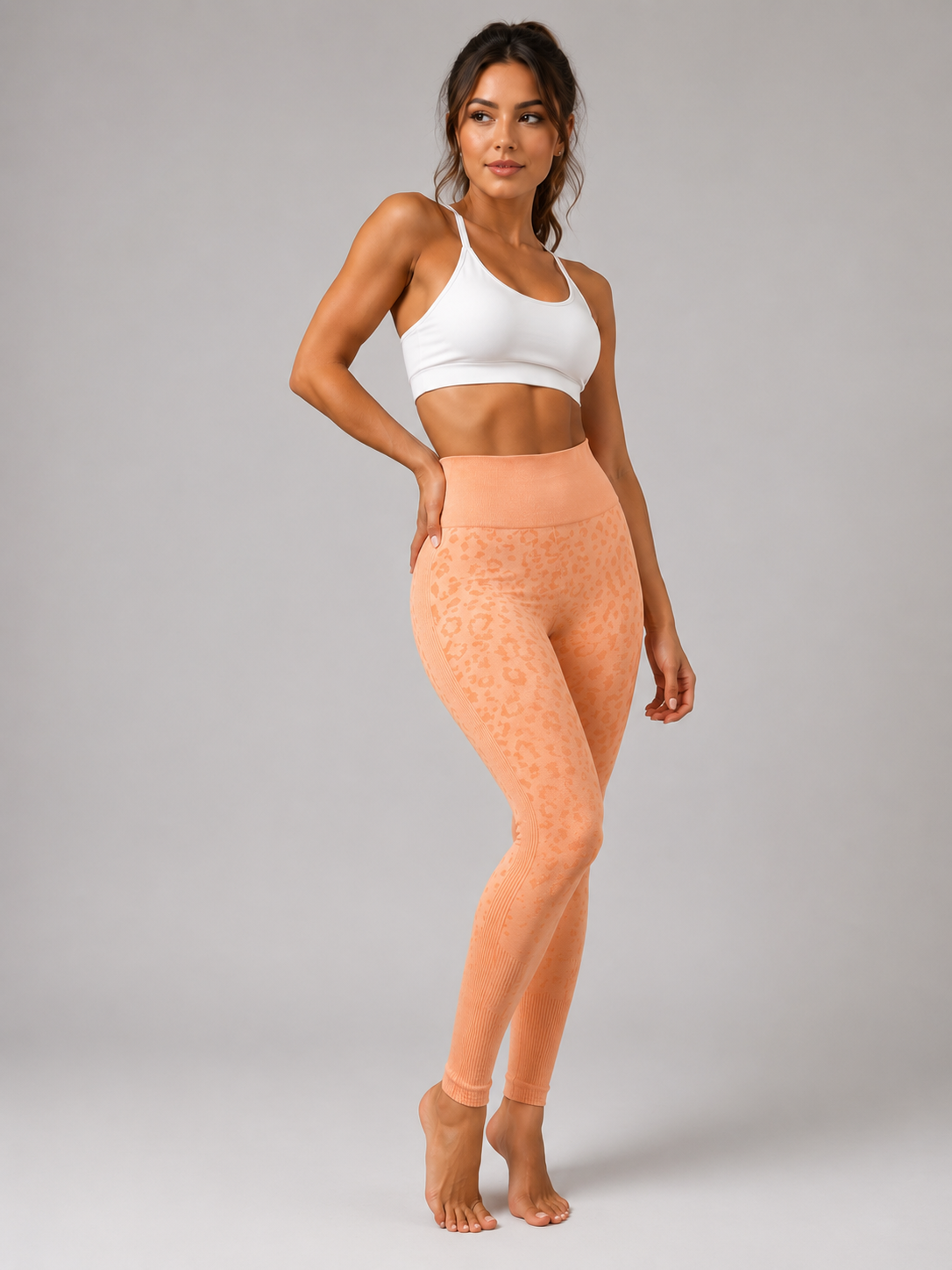 Womens orange peach leopard print seamless high waisted gym leggings with textured jacquard pattern and ribbed waistband activewear tights