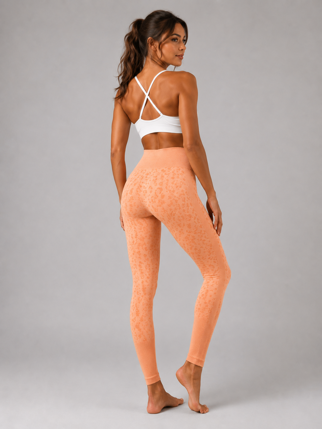 Womens orange peach leopard print seamless high waisted gym leggings with textured jacquard pattern and ribbed waistband activewear tights
