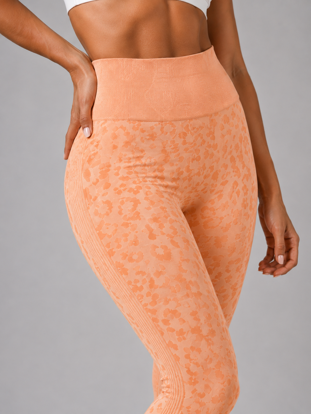 Womens orange peach leopard print seamless high waisted gym leggings with textured jacquard pattern and ribbed waistband activewear tights
