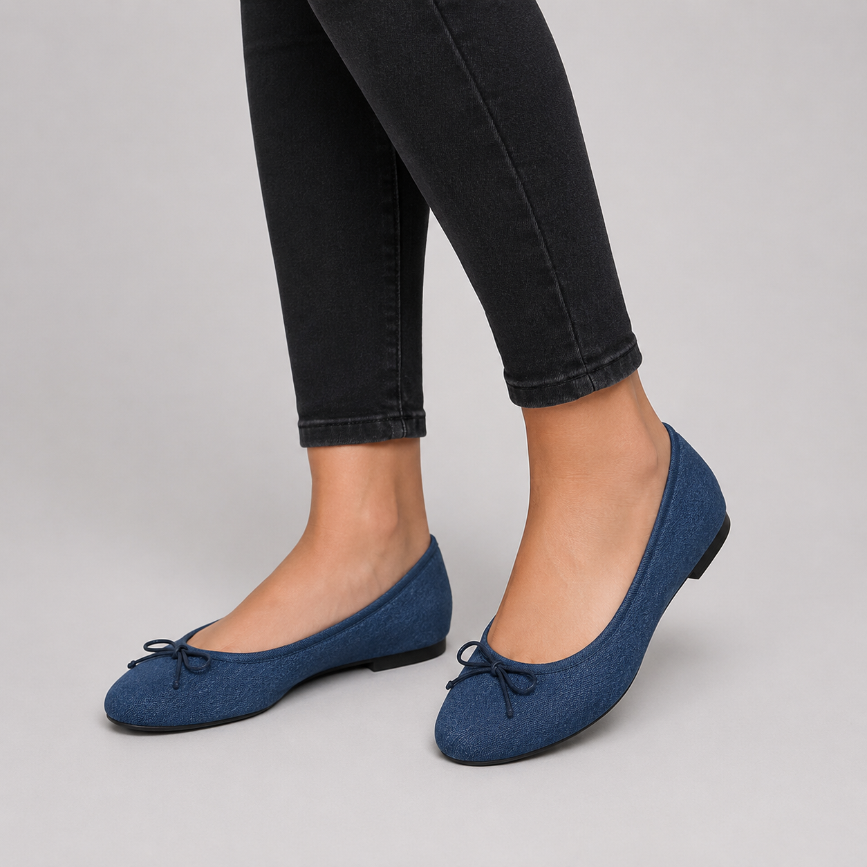 Women's navy ballet pumps featuring a Time & Tru memory foam cushioned insole with soft striped lining for all-day comfort.