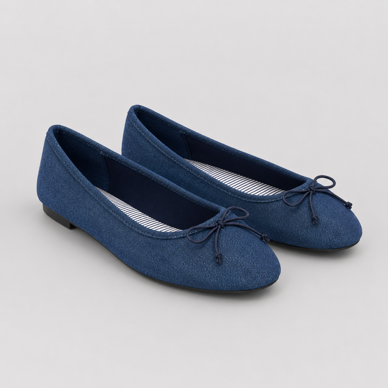 Women's navy ballet pumps featuring a Time & Tru memory foam cushioned insole with soft striped lining for all-day comfort.