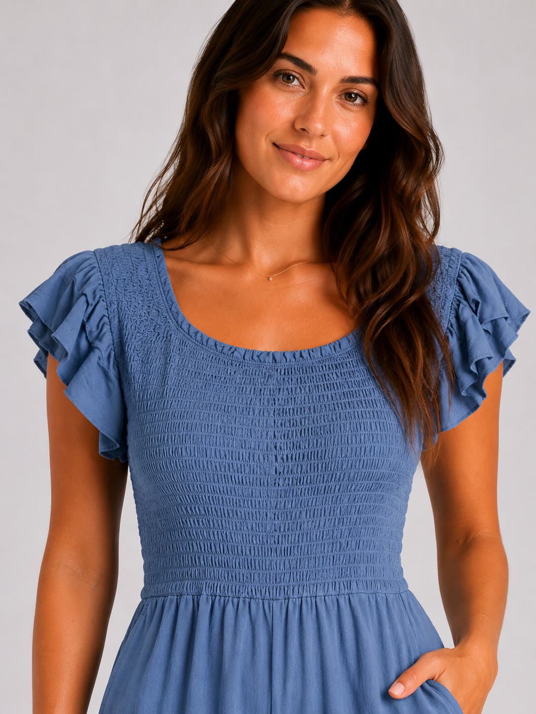 Denim blue womens shirred jumpsuit with puff sleeves and wide-leg cropped