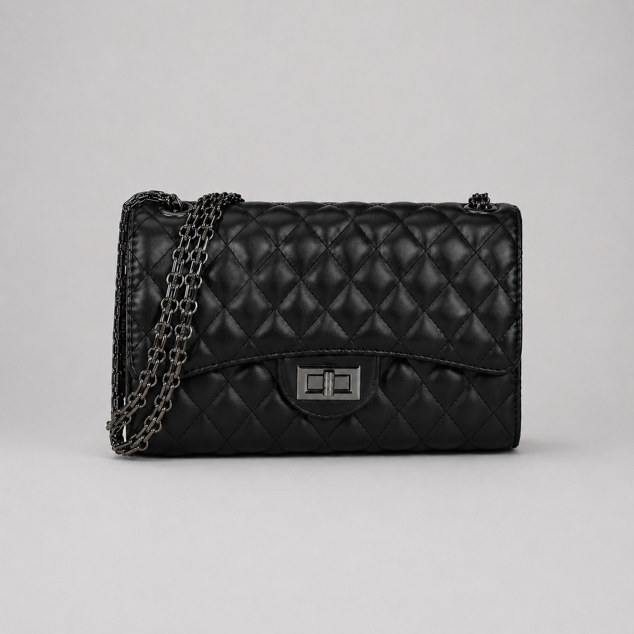 Ladies Black quilted faux leather shoulder and crossbody bag with chain strap and turn lock closure