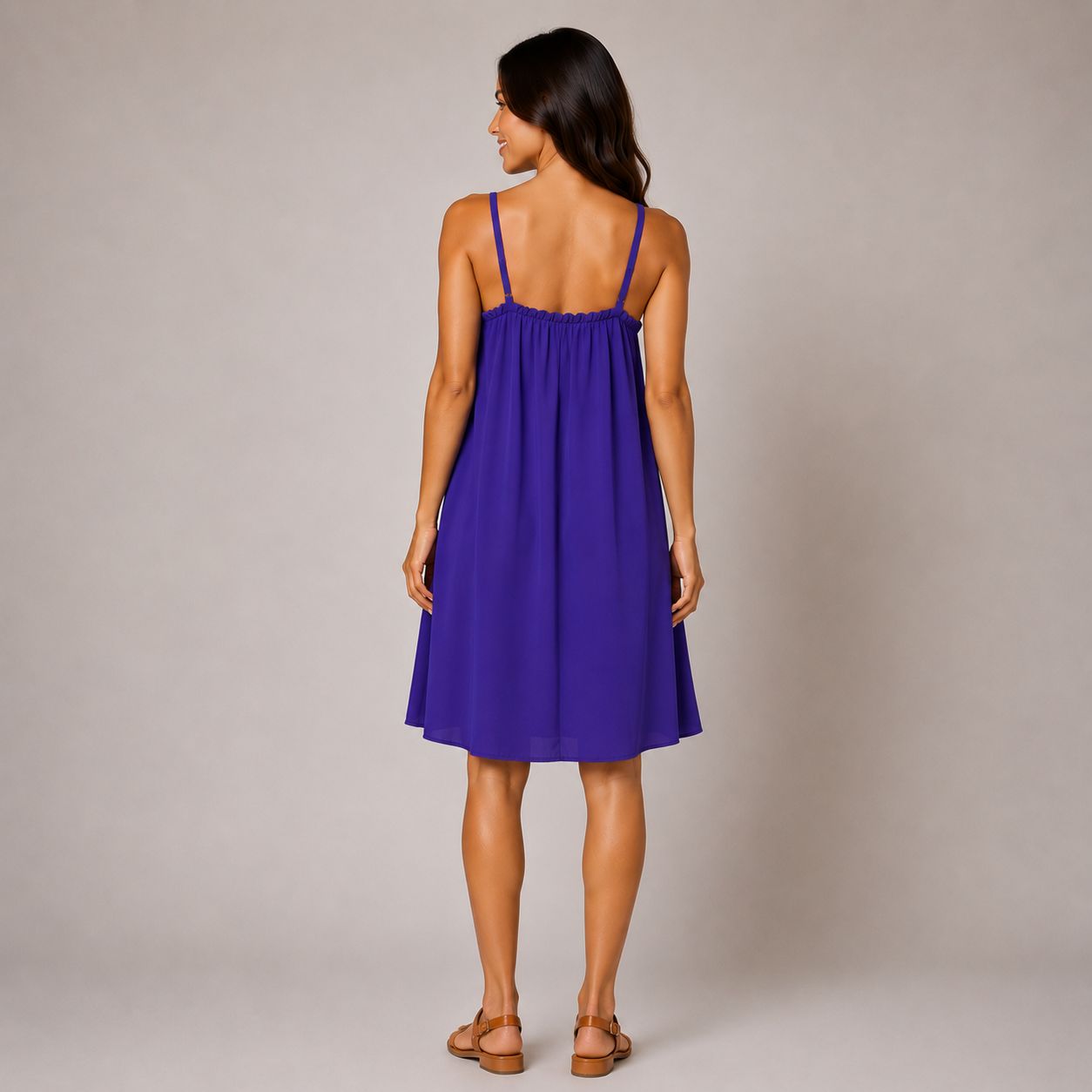 purple swing dress with a gathered neckline, thin shoulder straps and a relaxed knee-length silhouette.