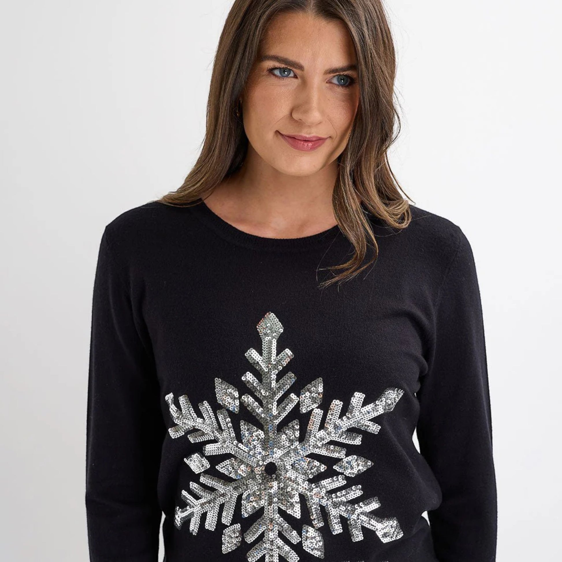 Ladies black Christmas jumper with large silver sequin snowflake design, long sleeves and festive xmas style.