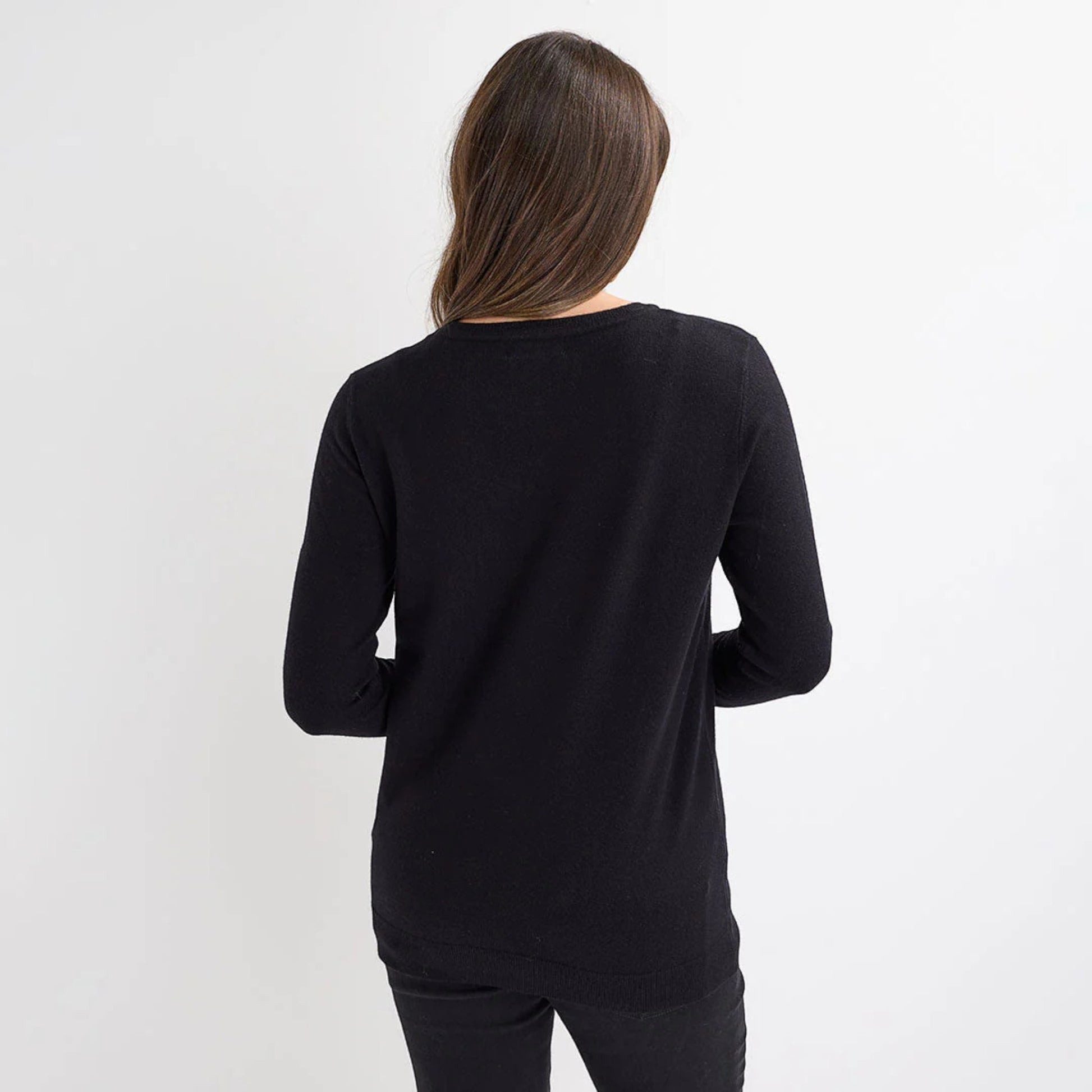 Ladies black Christmas jumper with large silver sequin snowflake design, long sleeves and festive xmas style.