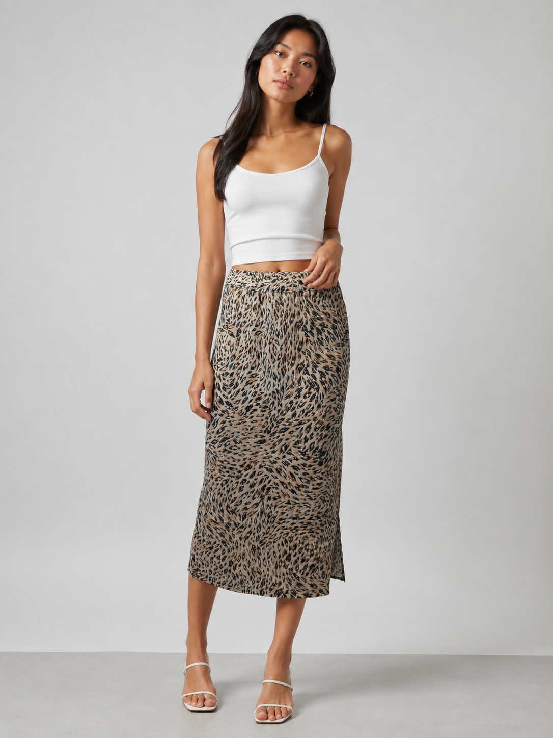 Women's midi pencil skirt with animal print – elastic waistband, lightweight fabric, and a flattering slim fit ideal for casual or evening wear.