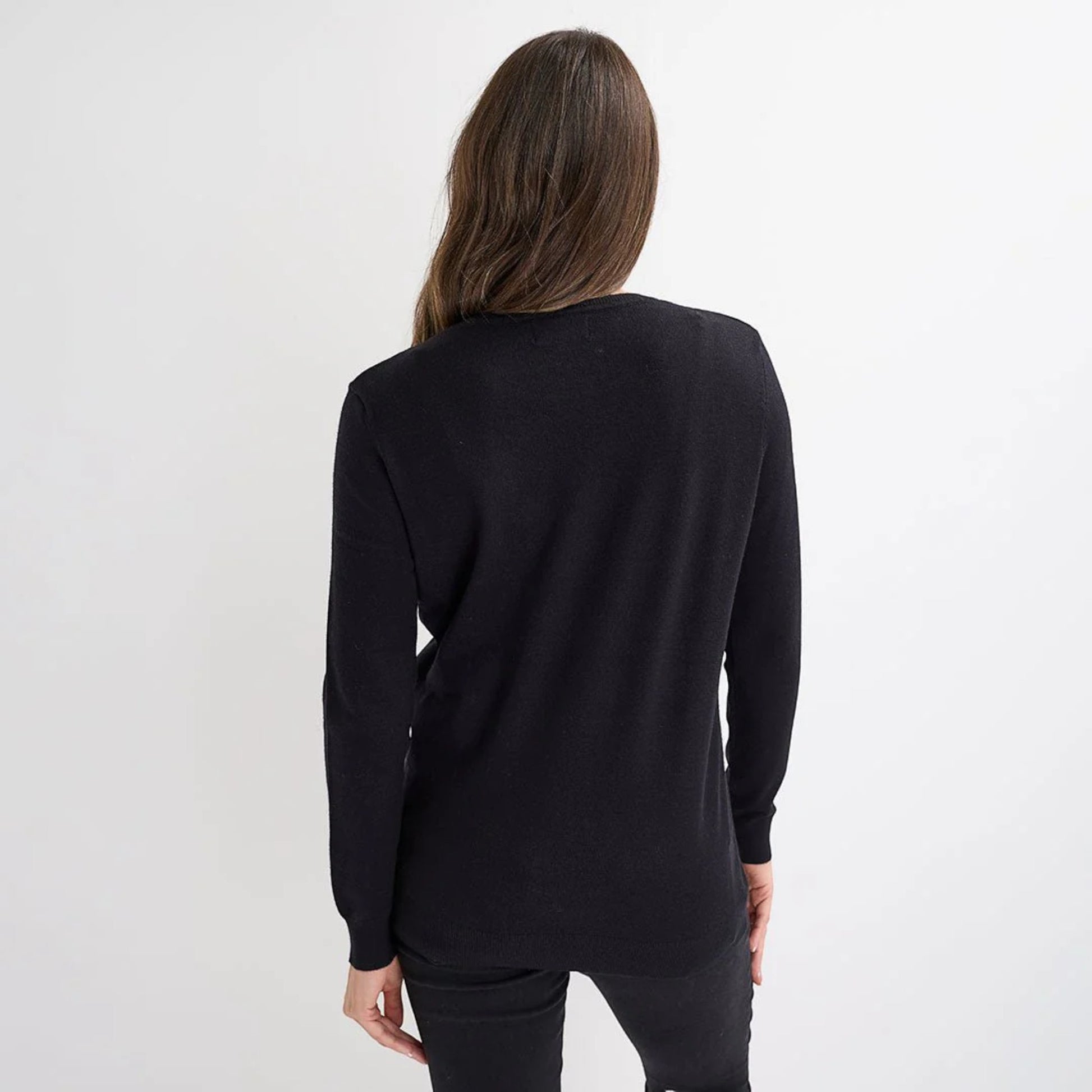 Ladies black Christmas jumper featuring multiple green sequin Christmas tree motifs, long sleeves and festive xmas design.