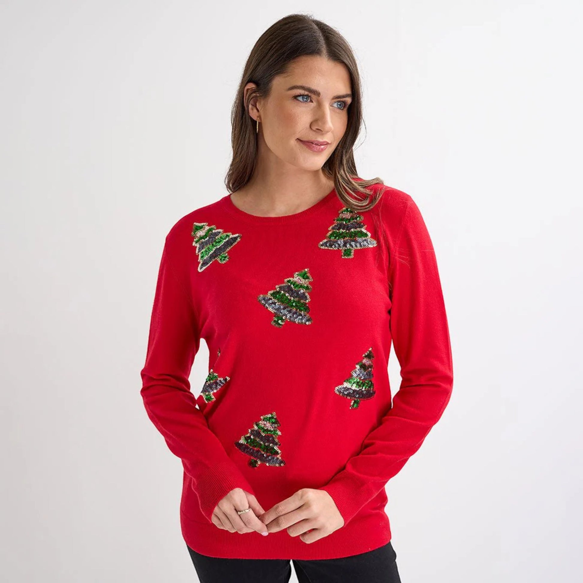 Ladies red Christmas jumper featuring multiple green sequin Christmas tree motifs, long sleeves and festive xmas design.