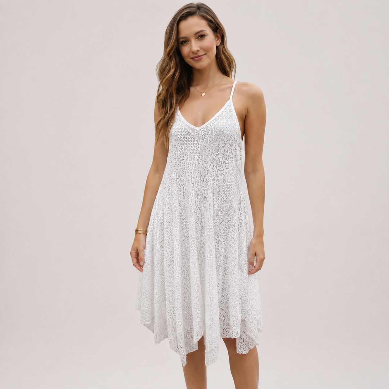 Elevate your warm-weather wardrobe with this asymmetrical lace slip dress, designed for effortless style and breathable comfort. Crafted from lightweight lace fabric, this V-neck lace sundress features a relaxed, flowy silhouette that drapes beautifully on the body. The delicate lace detailing and adjustable spaghetti straps create a flattering, feminine look perfect for any occasion.