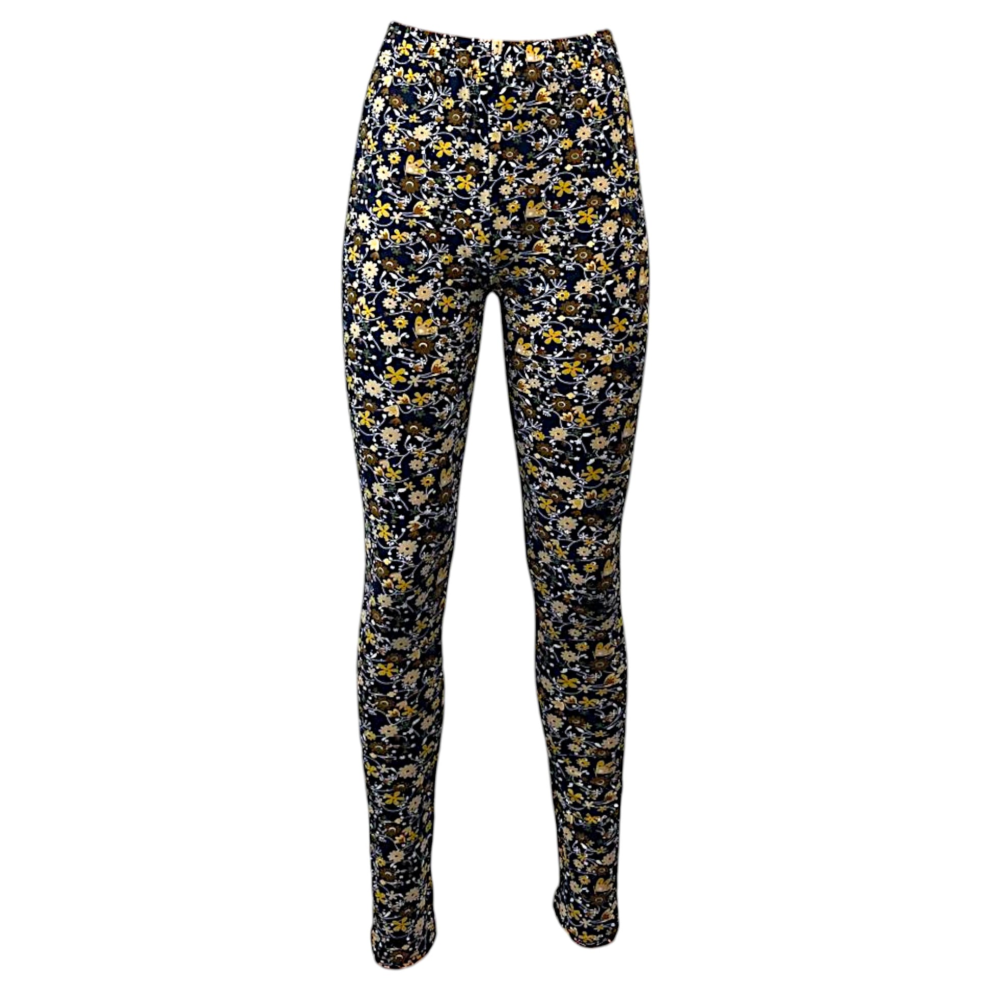 Women's full-length navy leggings with a colorful floral print pattern, soft stretch fabric, and high-waisted design for casual and active wear.