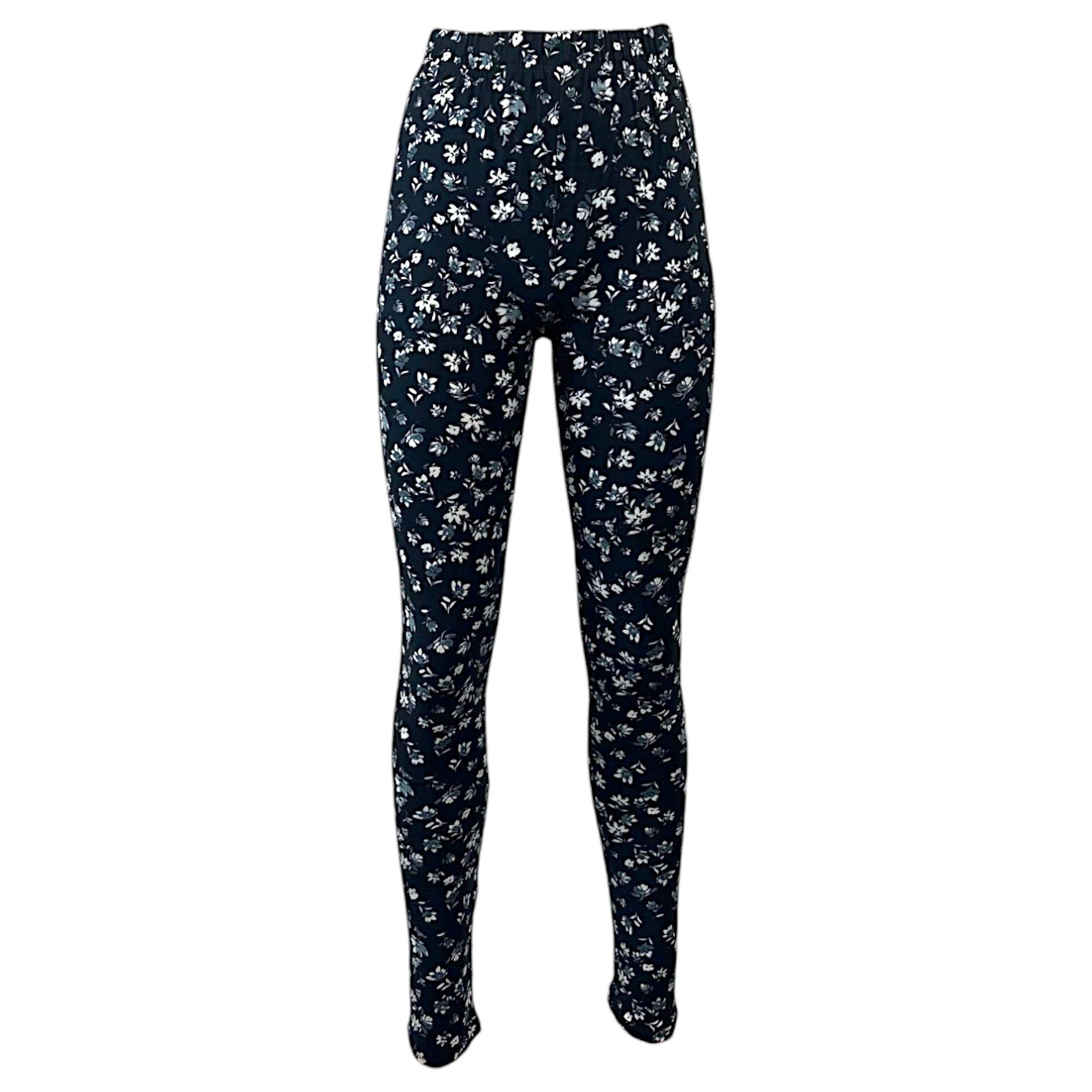 Ladies full-length women's leggings in black with white floral print, soft stretchy fabric, ideal for casual wear, yoga, and everyday outfits.