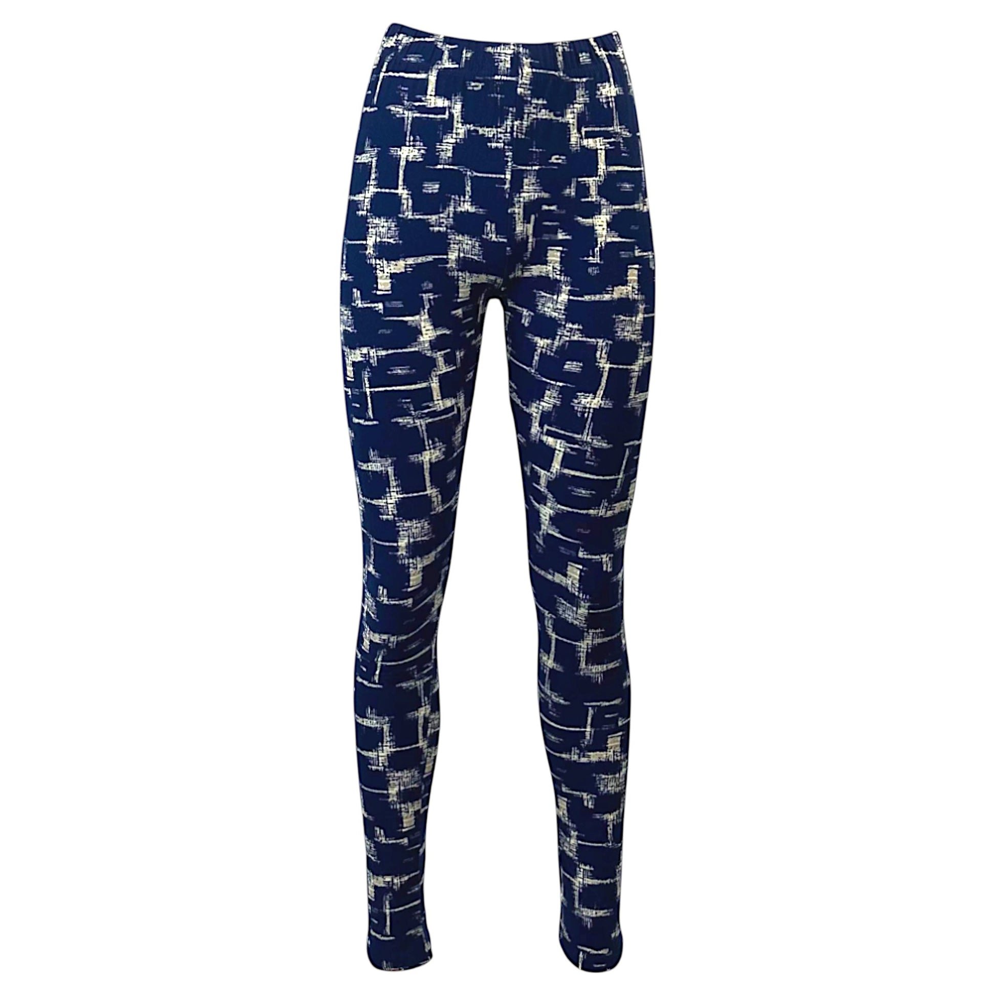 Women's navy blue leggings with beige Aztec-inspired abstract print, full-length stretch fit.