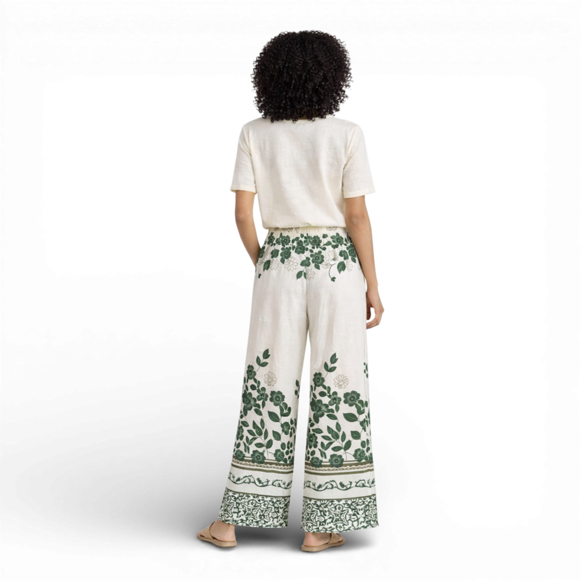 Beautiful cream wide-leg trousers featuring an elegant all-over floral print. Designed with a comfortable elasticated waistband and drawstring tie for an adjustable fit.