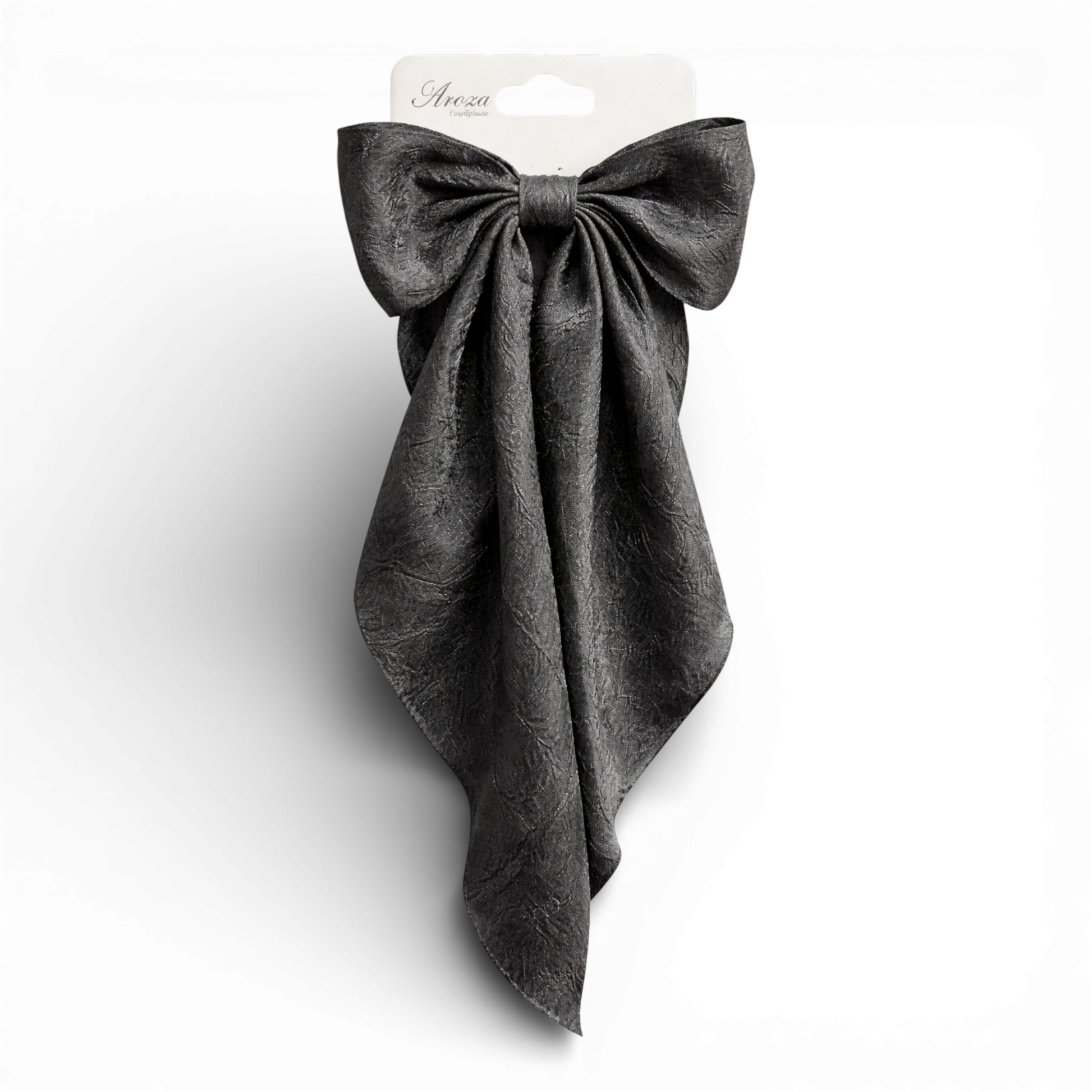 Add a beautiful finishing touch with our oversized organza hair bow. Made from soft, lightweight fabric with a subtle shimmer, it features elegant long tails for a statement look.