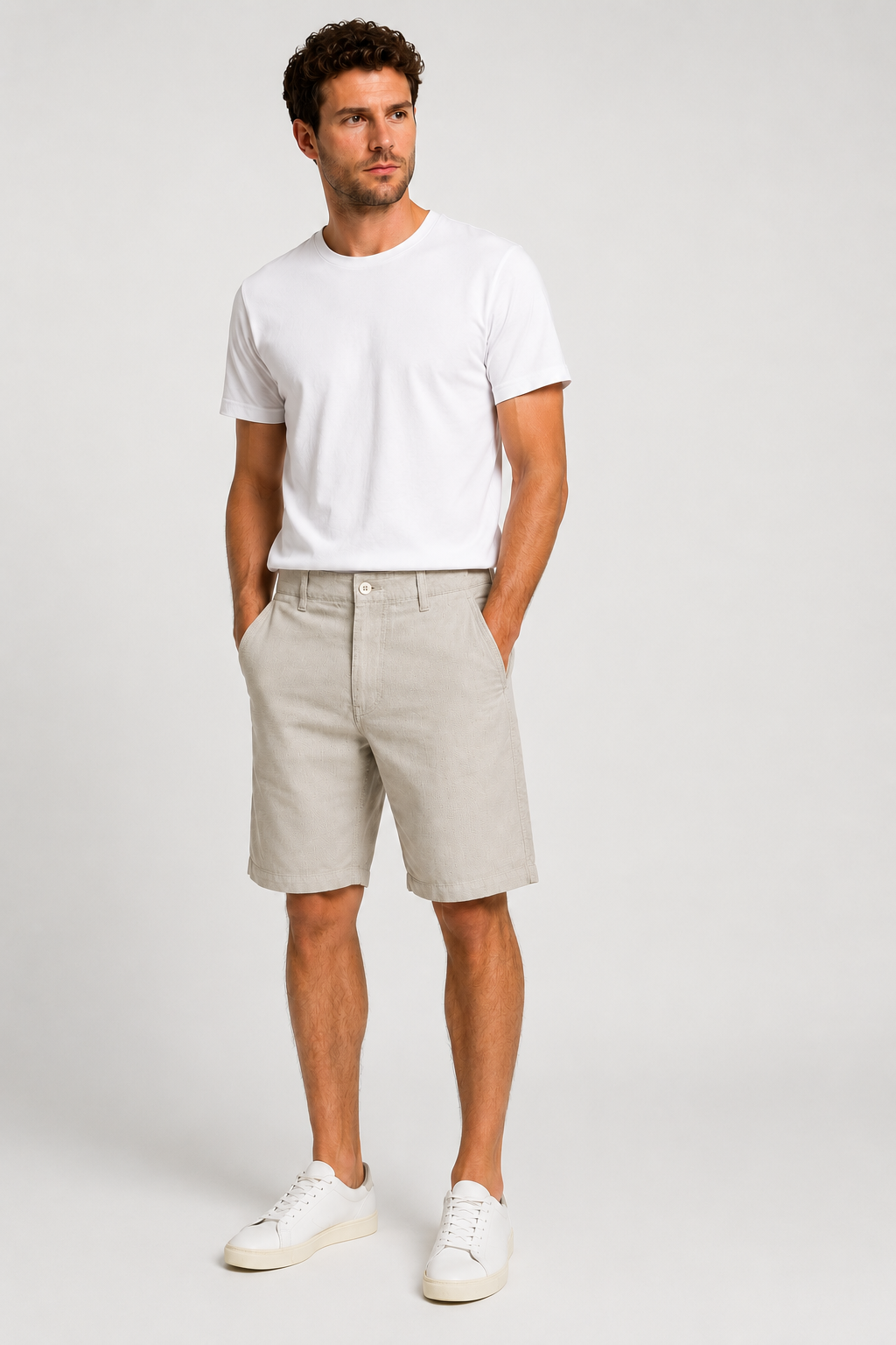Men’s stone beige cotton stretch twill shorts with tailored fit, side pockets, rear welt pocket, and textured woven fabric for smart casual summer wear.