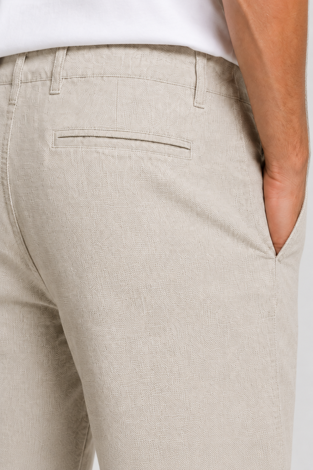 Men’s stone beige cotton stretch twill shorts with tailored fit, side pockets, rear welt pocket, and textured woven fabric for smart casual summer wear.