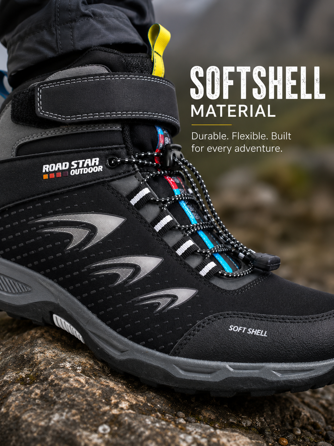 Men's black softshell waterproof hiking boots with quick-lace system worn on a mountain hiking trail, lightweight outdoor walking shoes with rugged grip sole.