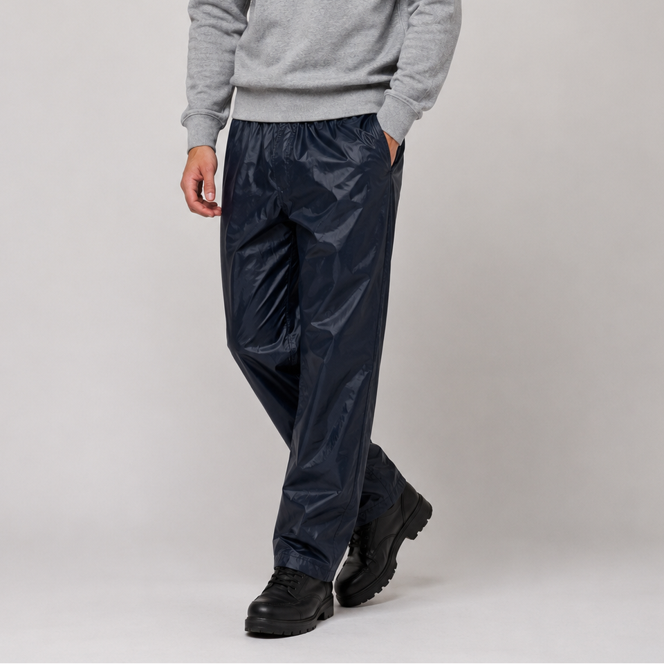Stay dry in all weather with these lightweight waterproof over trousers. Featuring a comfortable elastic waistband and durable rainproof material, ideal for workwear, outdoor activities, walking, cycling, and wet weather protection.