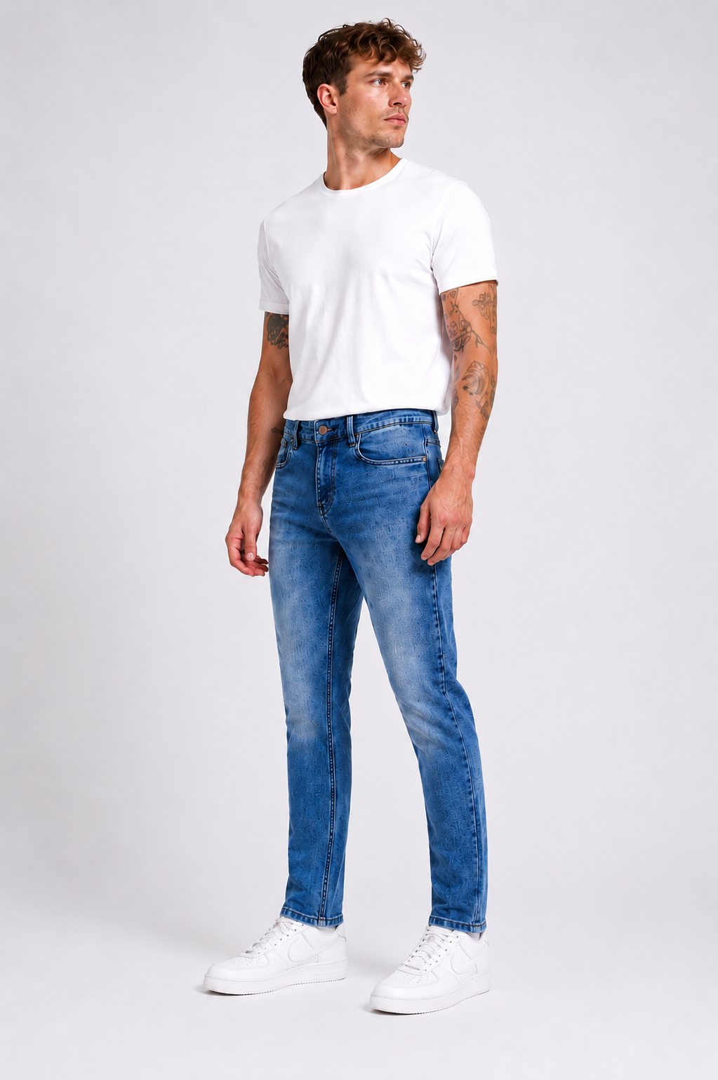 Men's JDN branded slim fit jeans in light wash blue denim with tapered leg and classic five-pocket design