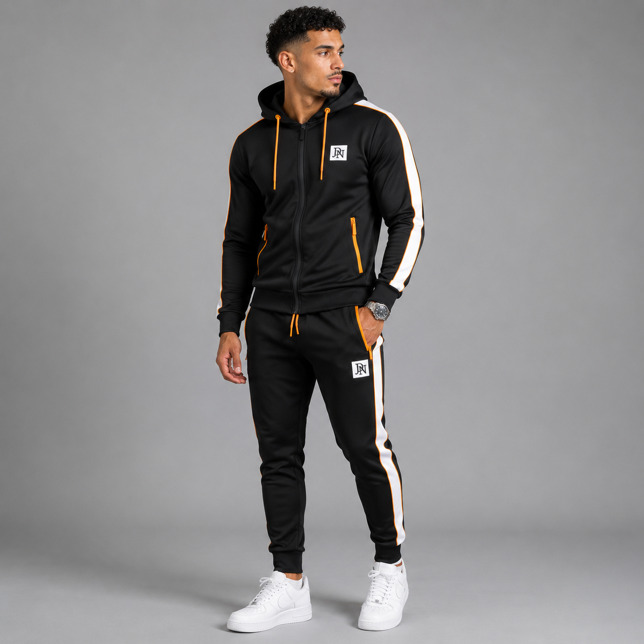Men's JDN black tracksuit set with orange zip details and white side stripes – full zip hoodie and joggers, sporty streetwear style