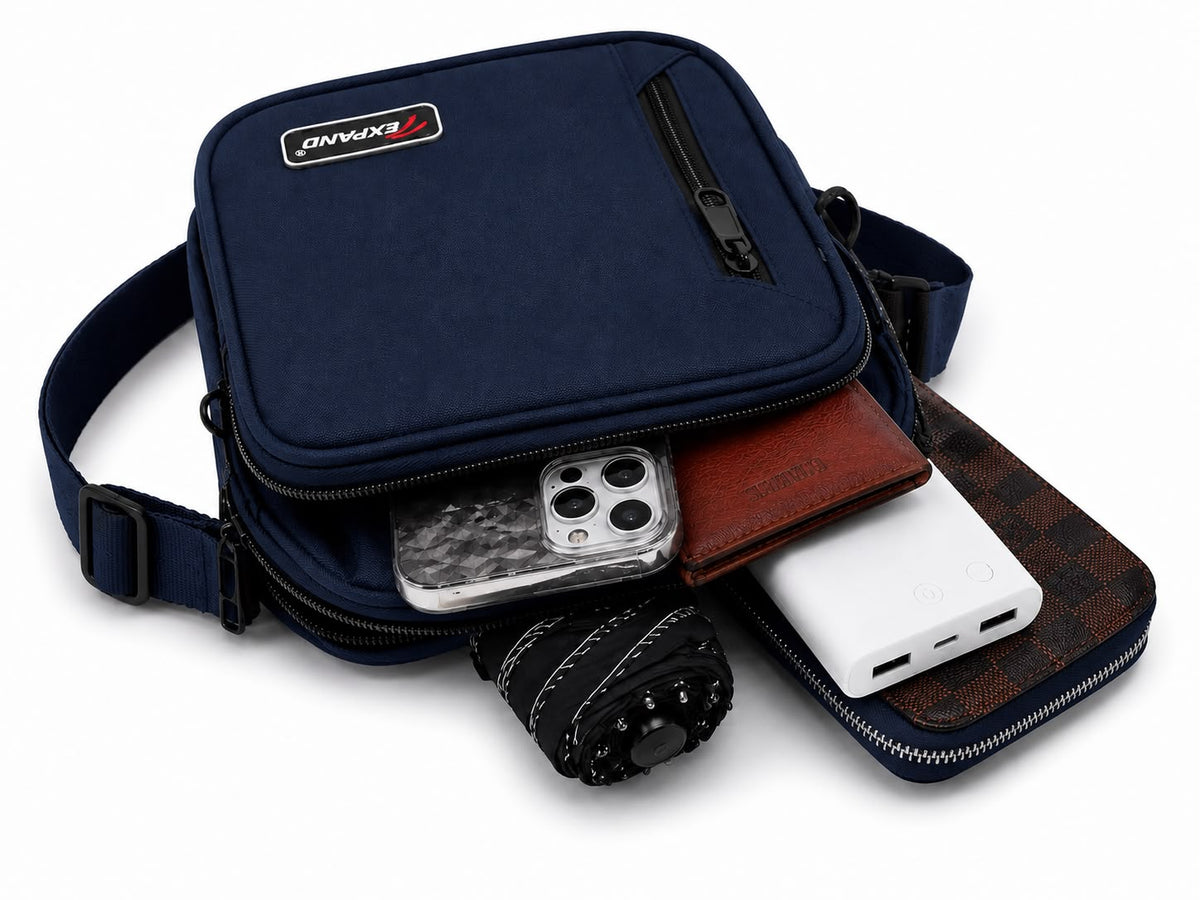 Navy men’s crossbody bag with adjustable shoulder strap, multiple zipped compartments and a compact design, ideal for everyday use, travel and keeping essentials organised.